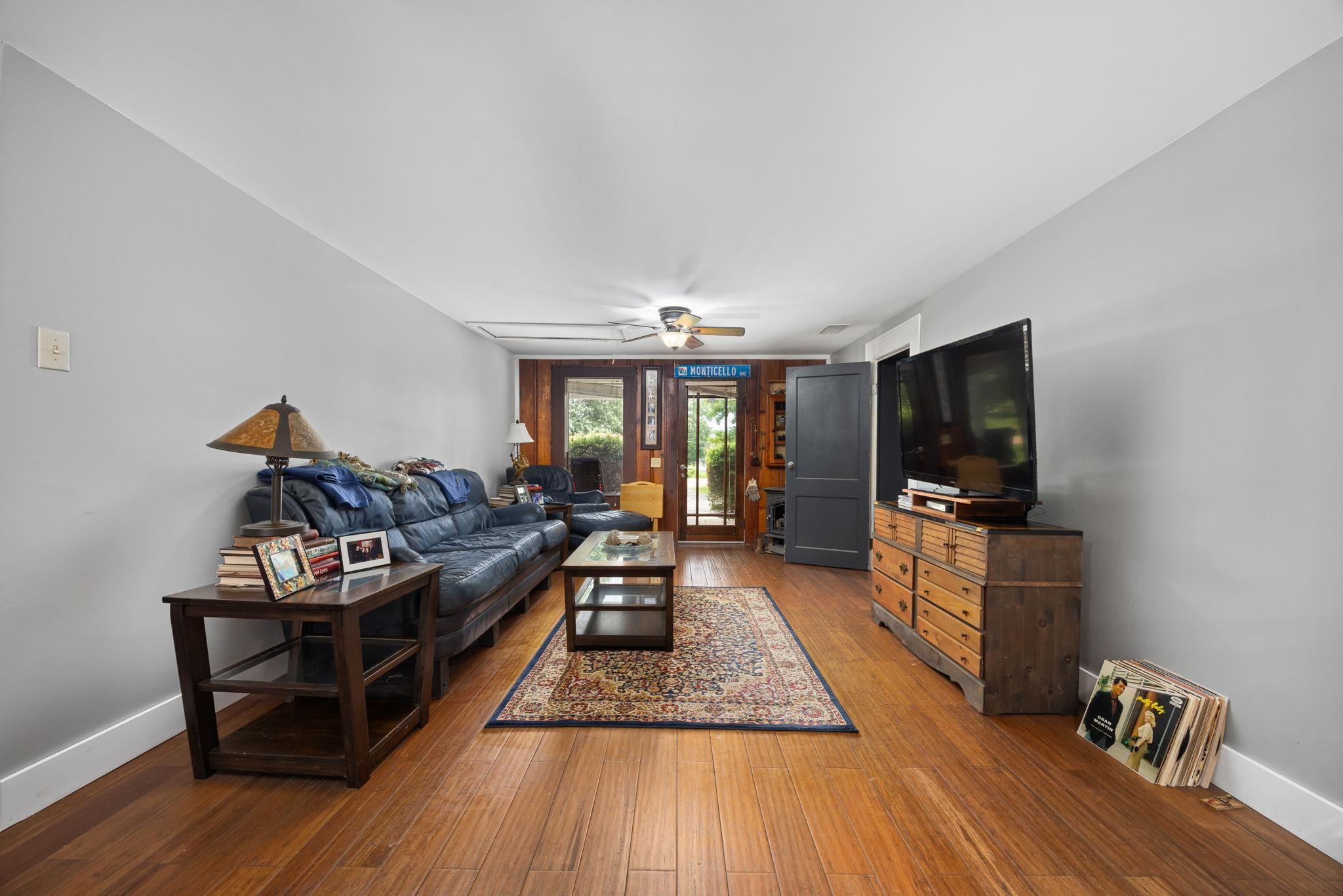 Living room featuring french doors, hardwood / wood-style floors, and ceiling fan