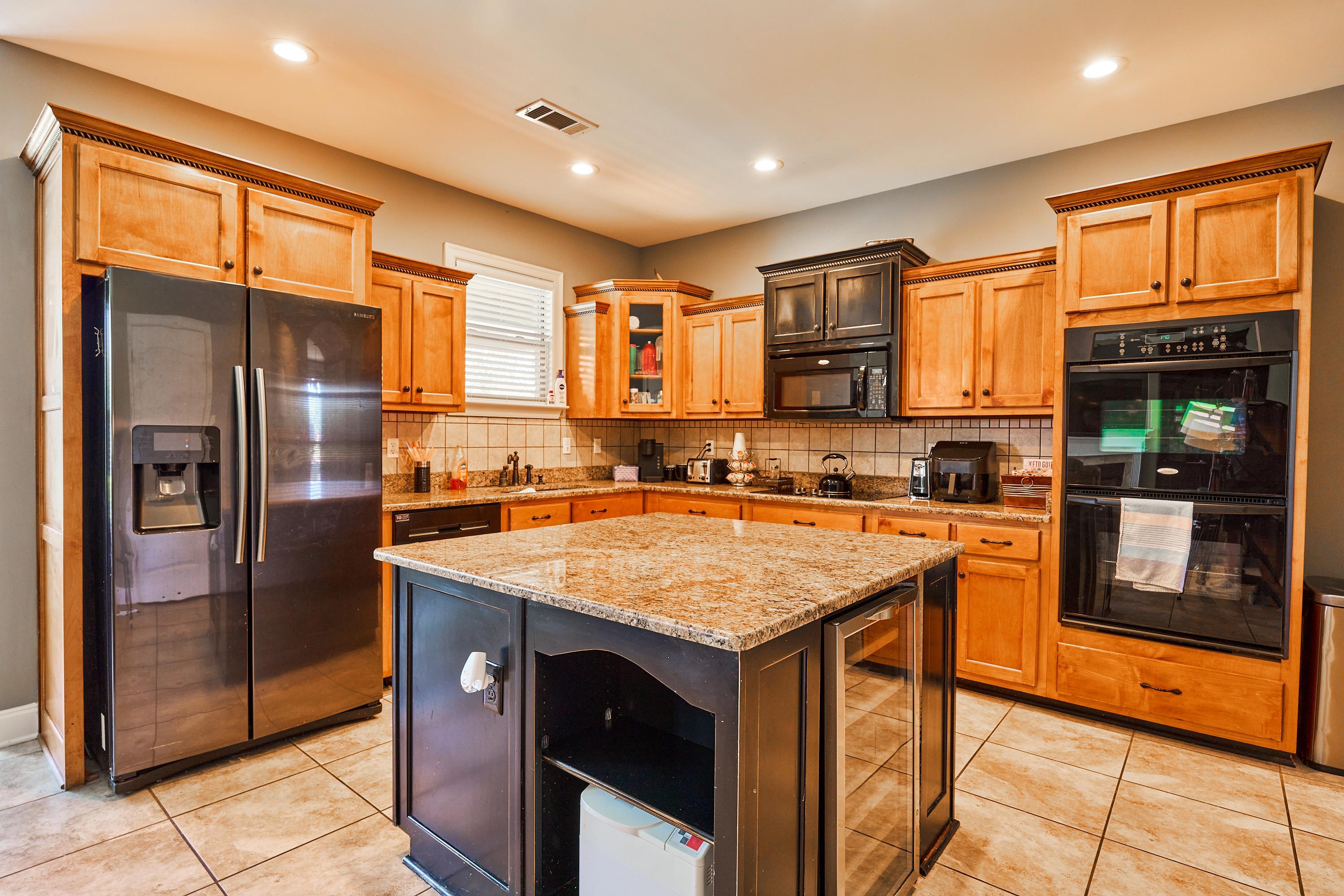 Kitchen features Stainless appliances iand has a brand new cooktop.