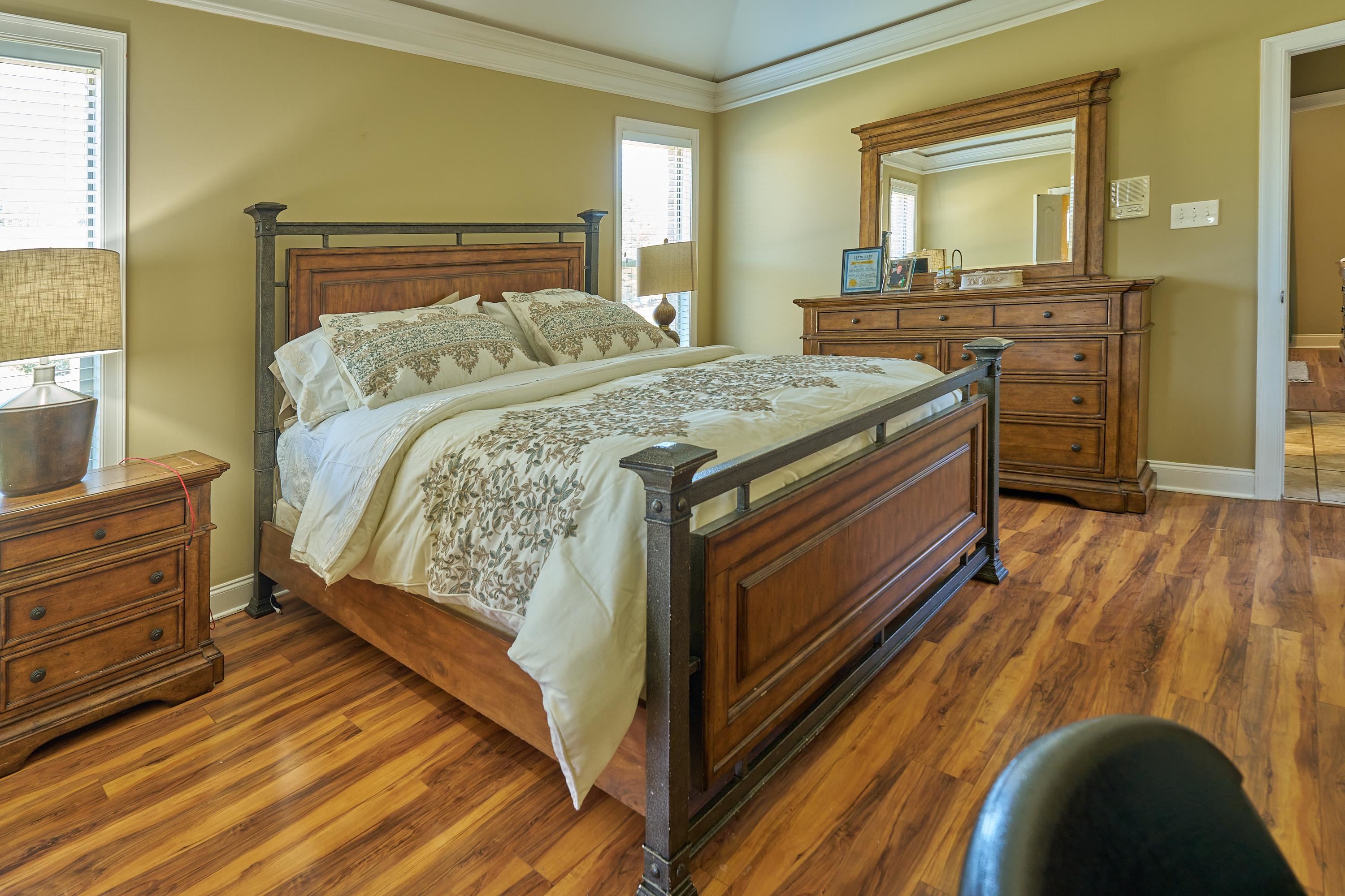 Very large primary bedroom with  ceiling tray ceiling