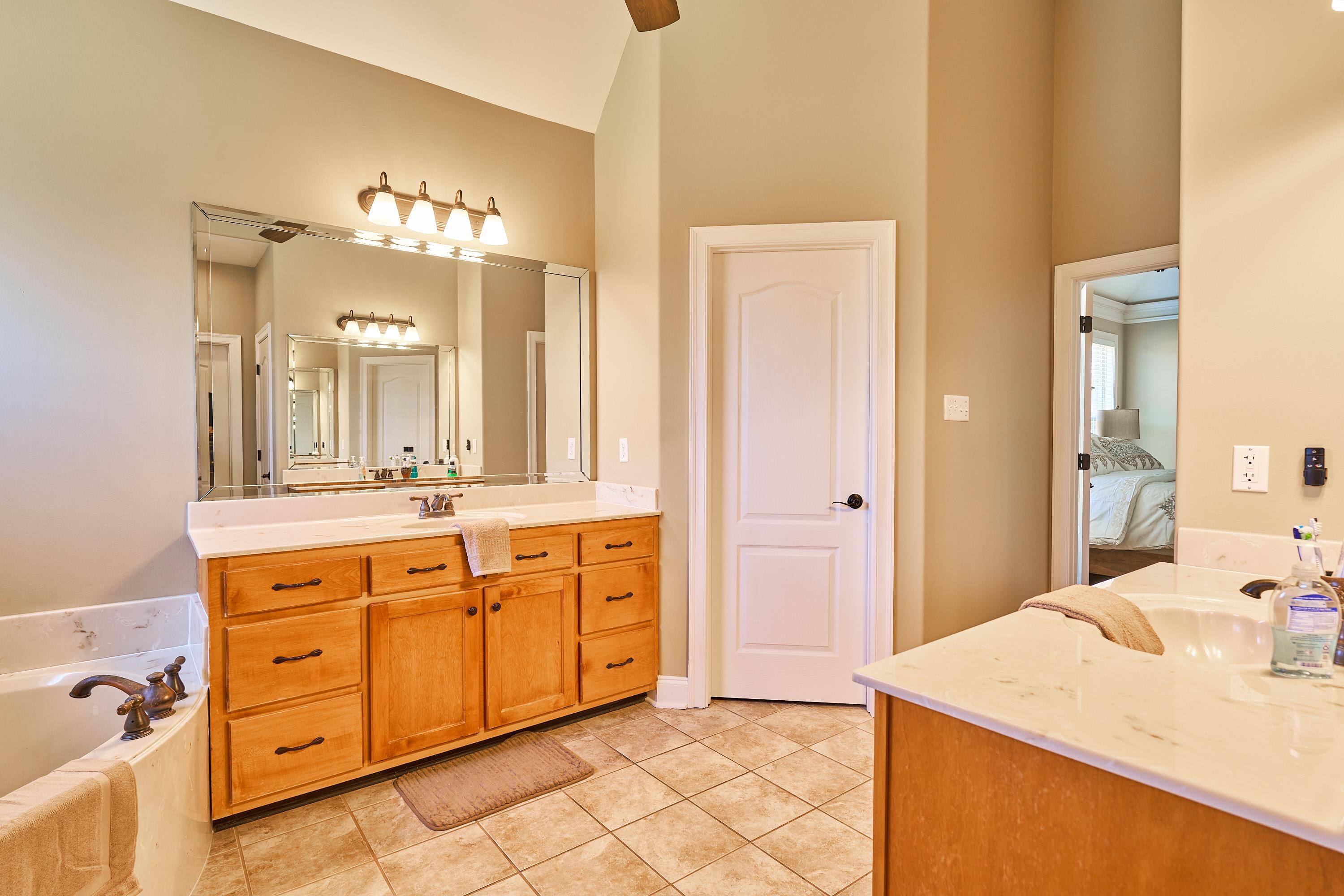 High ceiling in the primary bath.  This is more the true color.