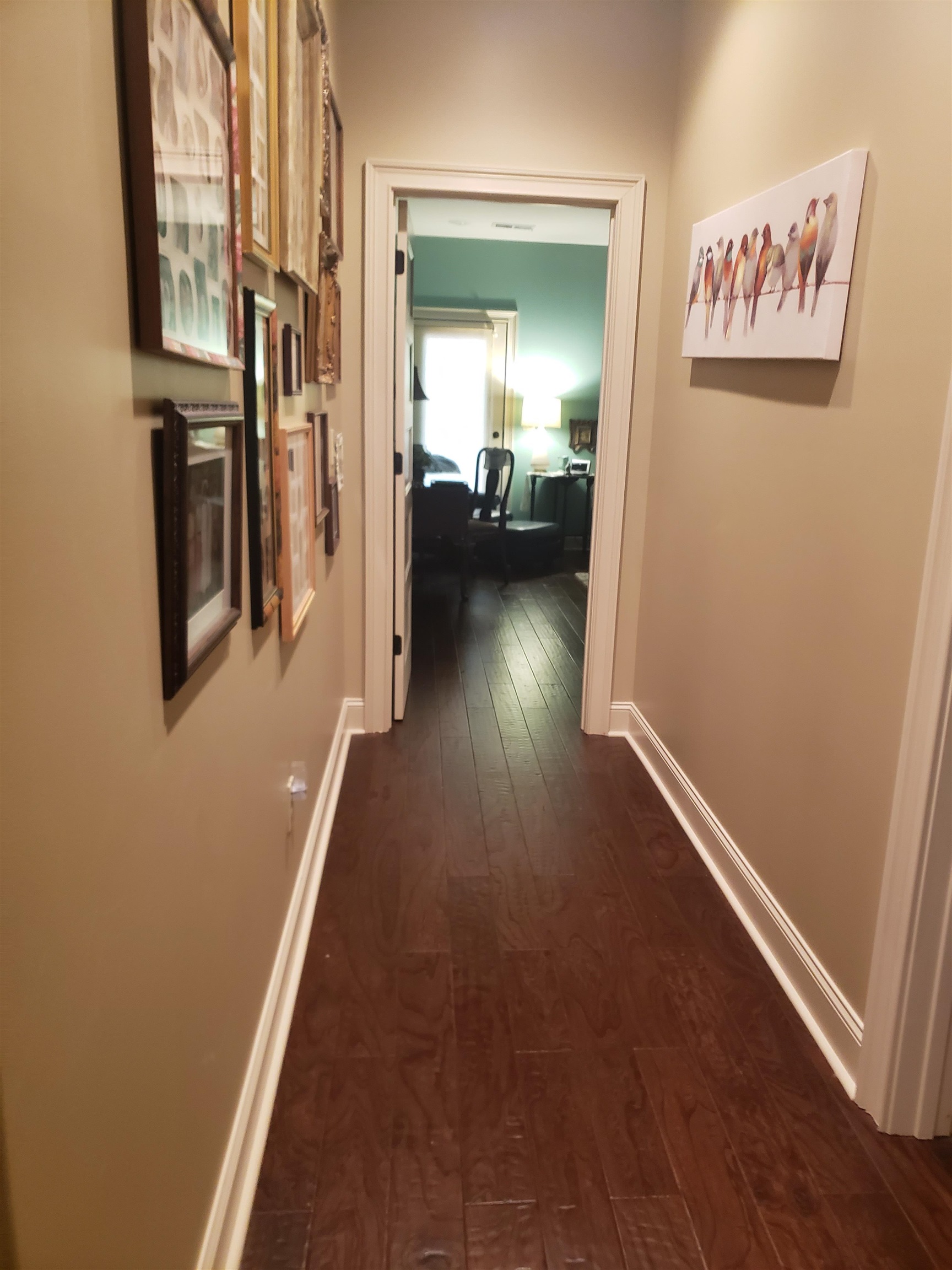 Hall featuring dark wood-type flooring