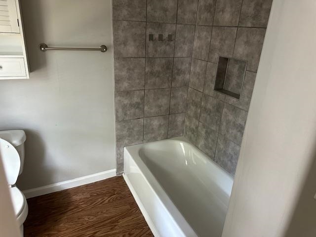 Bathroom featuring toilet and hardwood / wood-style flooring