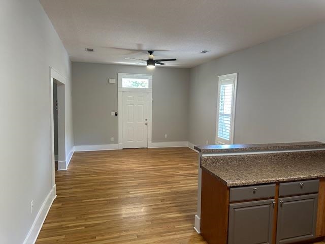 Interior space with light wood-type flooring and ceiling fan