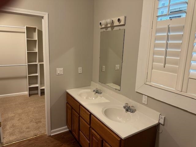 Bathroom featuring vanity and hardwood / wood-style floors