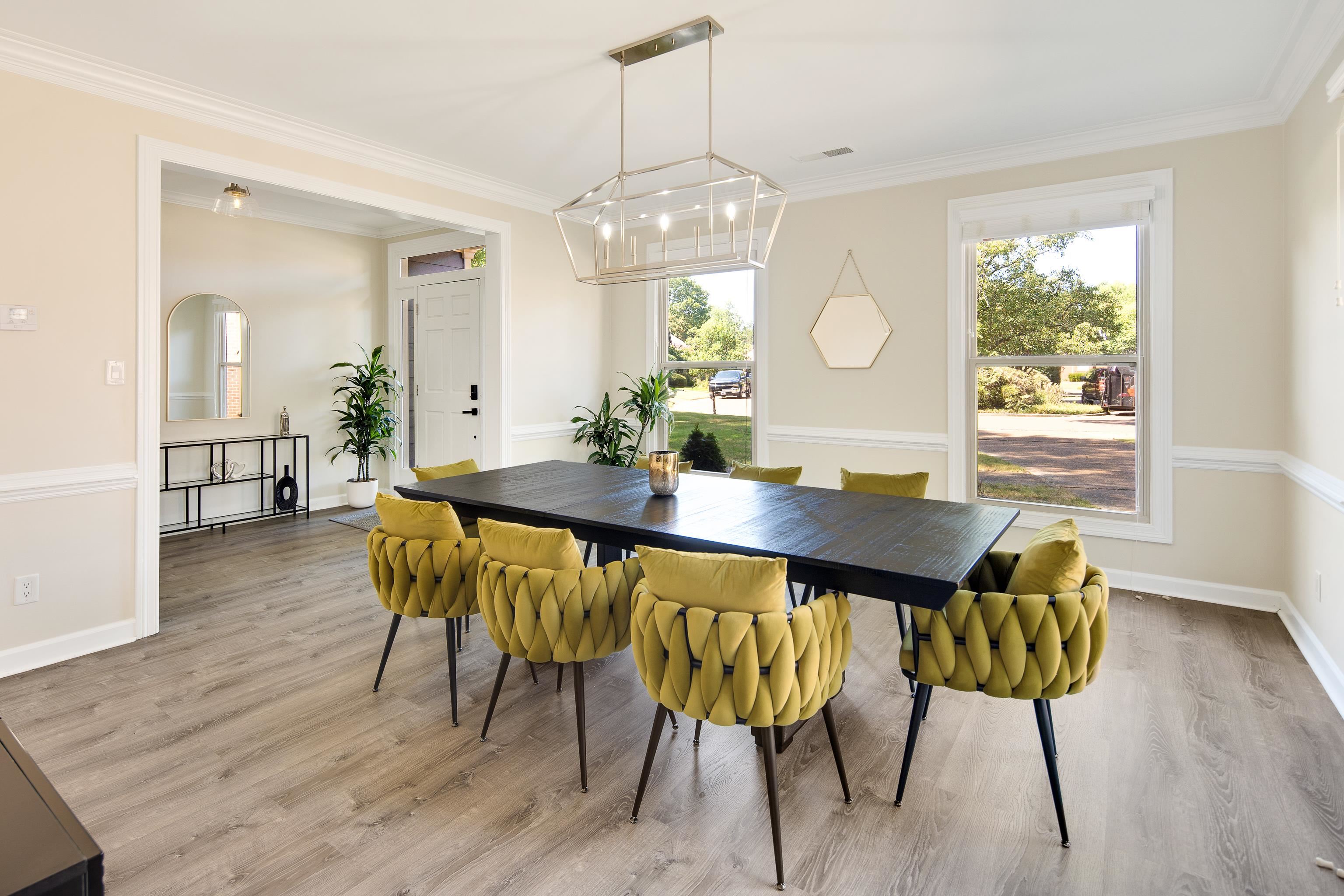 Dining room featuring crown molding, plenty of natural light, and light hardwood / wood-style flooring