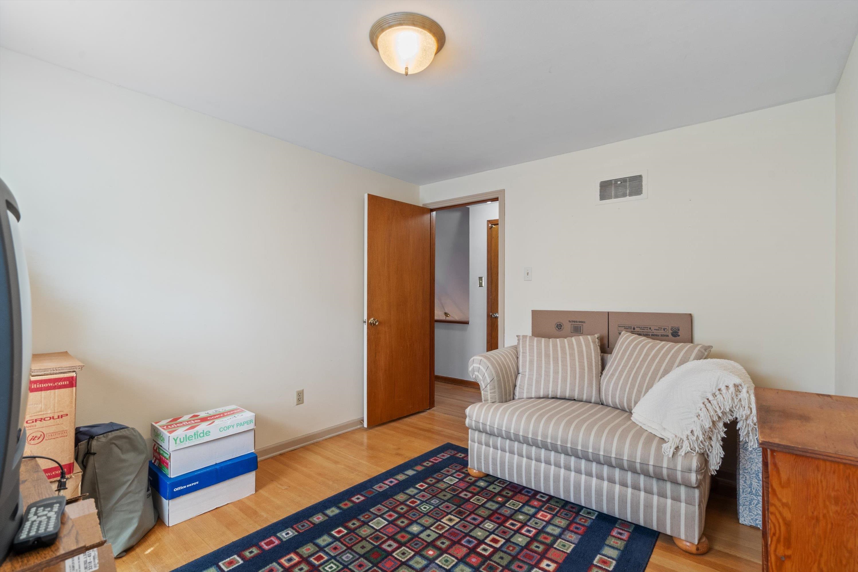 Bedroom with light hardwood / wood-style floors