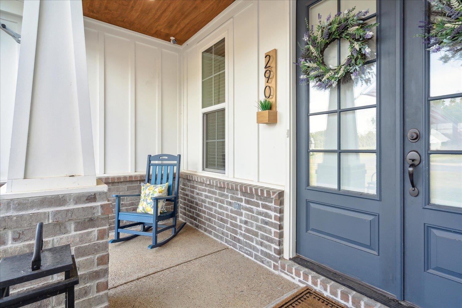 View of exterior entry with a porch