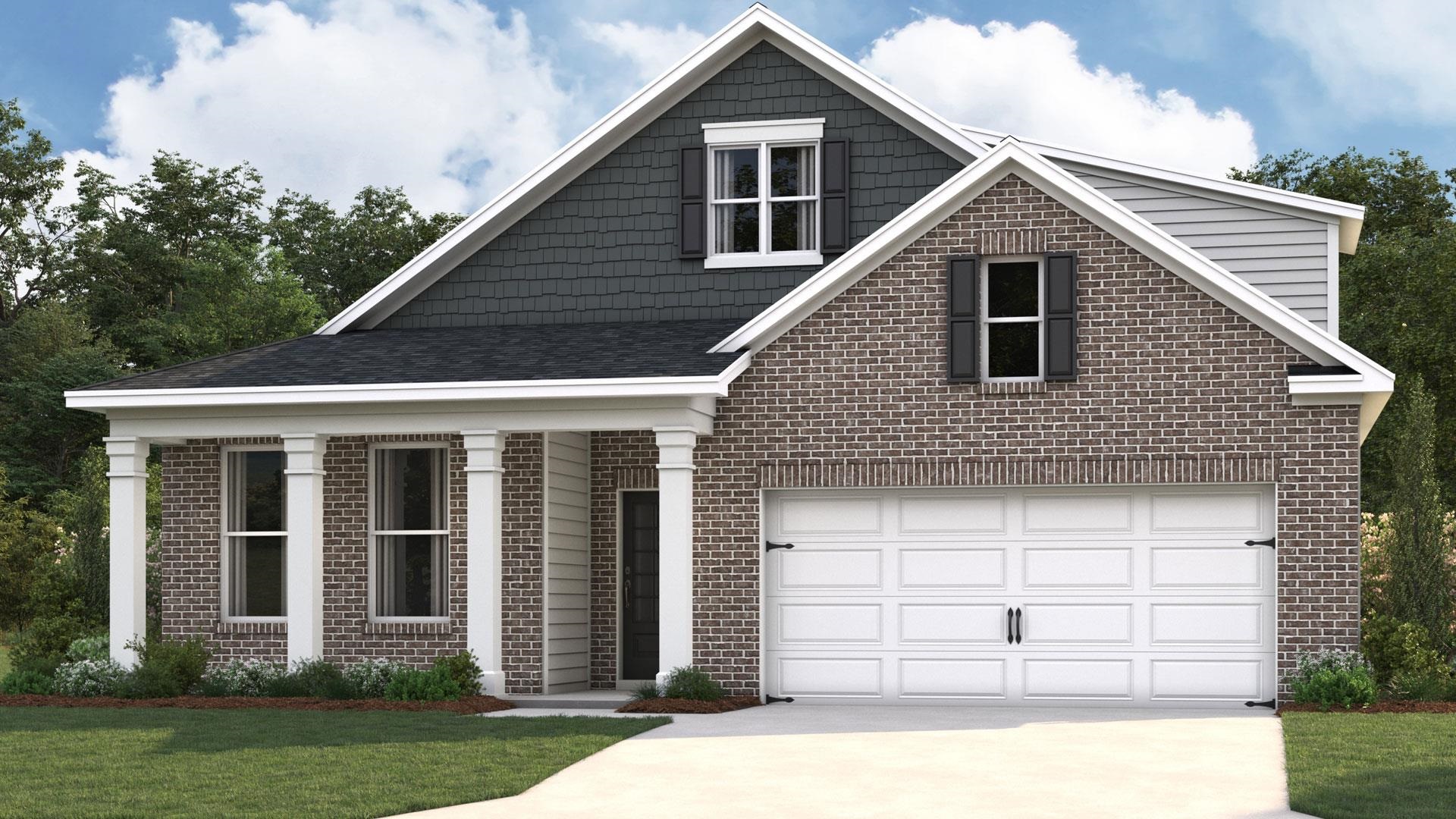 View of front of house featuring a garage and a front lawn