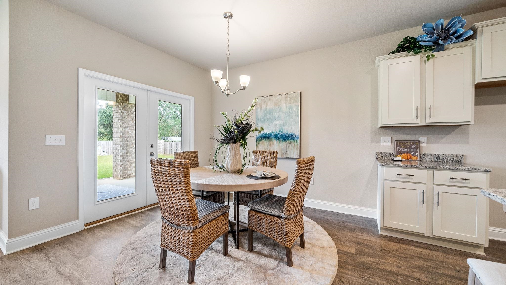 Dining space with a chandelier and hardwood / wood-style floors