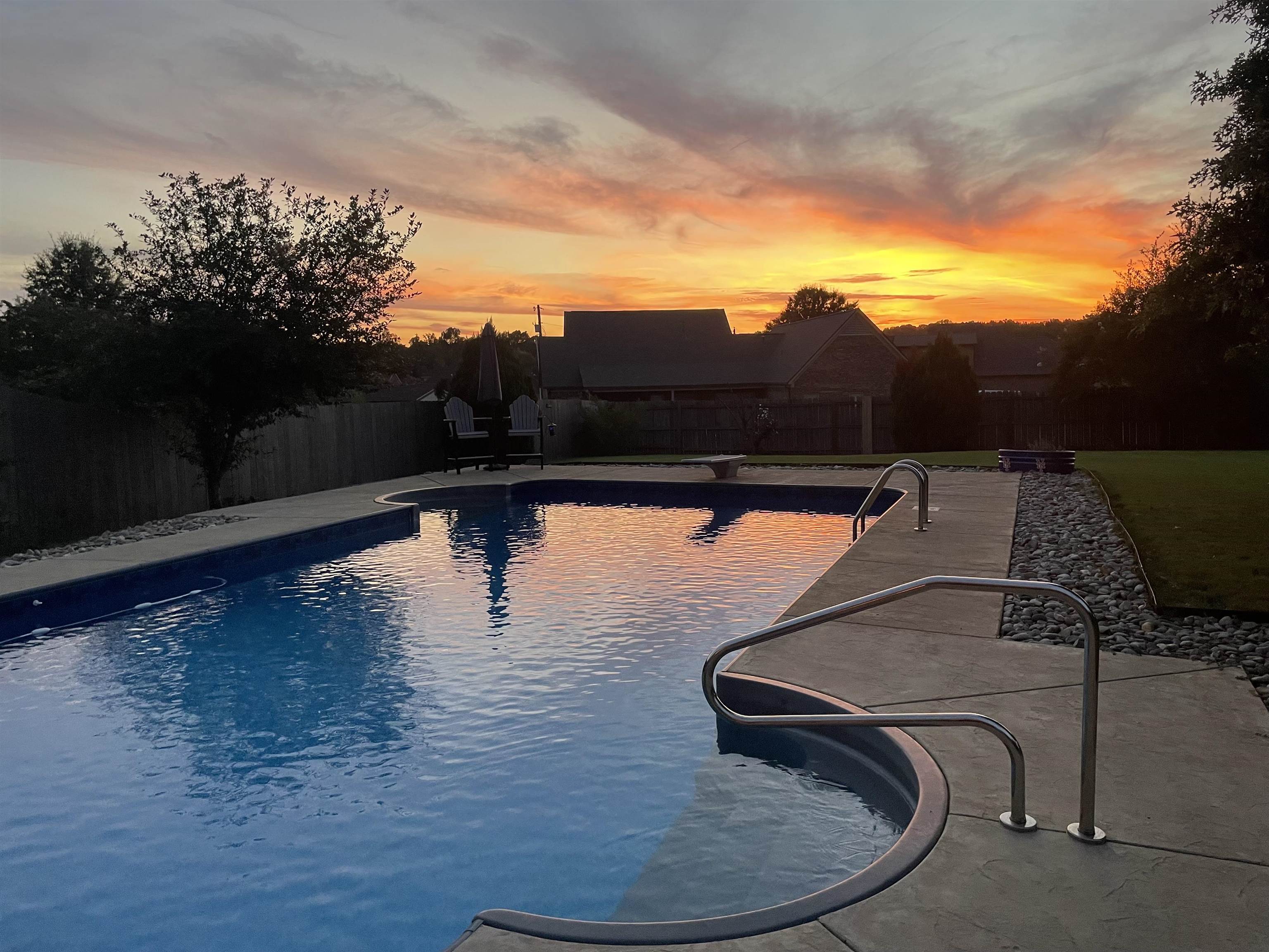 View of pool at dusk