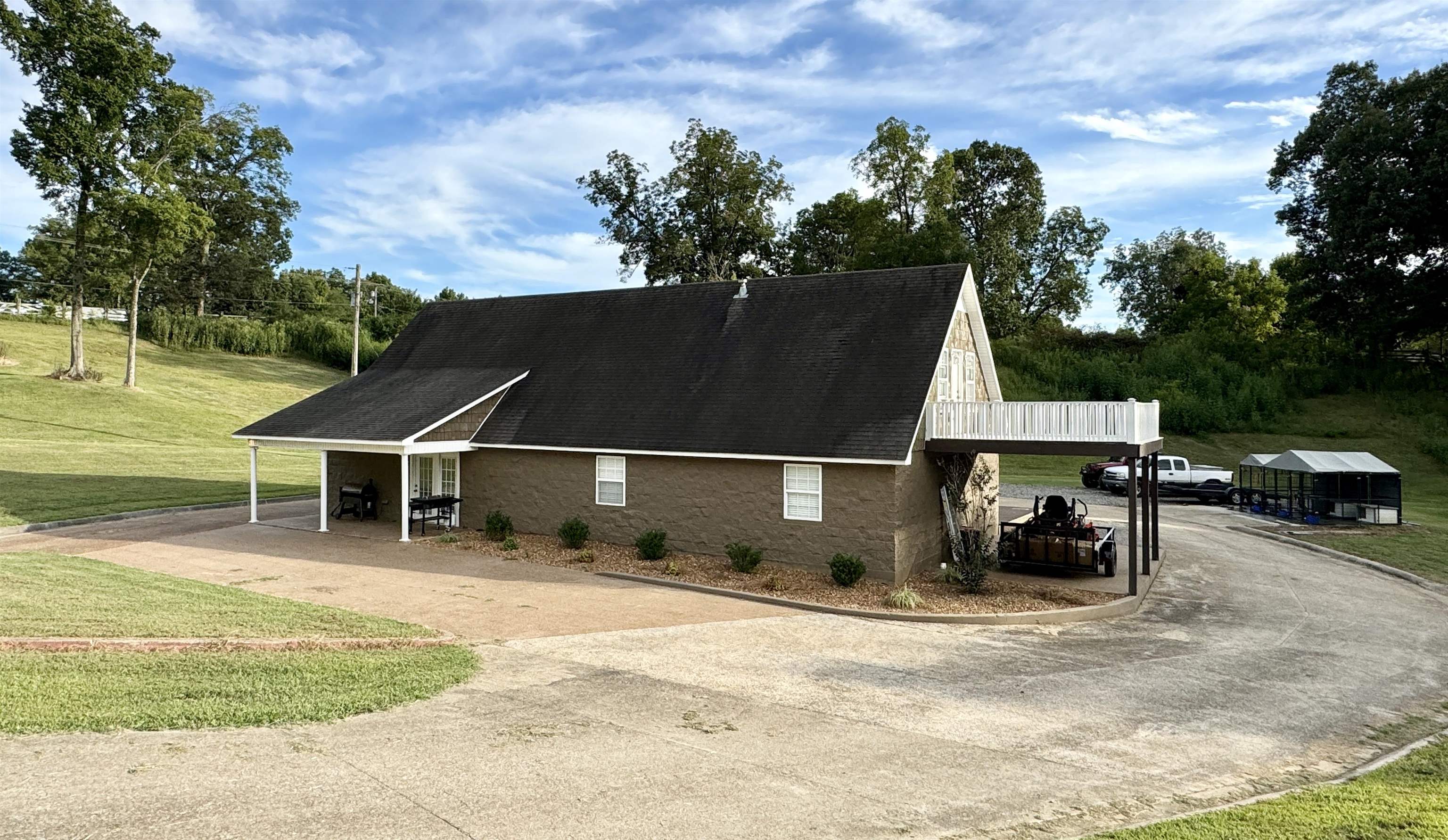 View of home\'s exterior with a yard