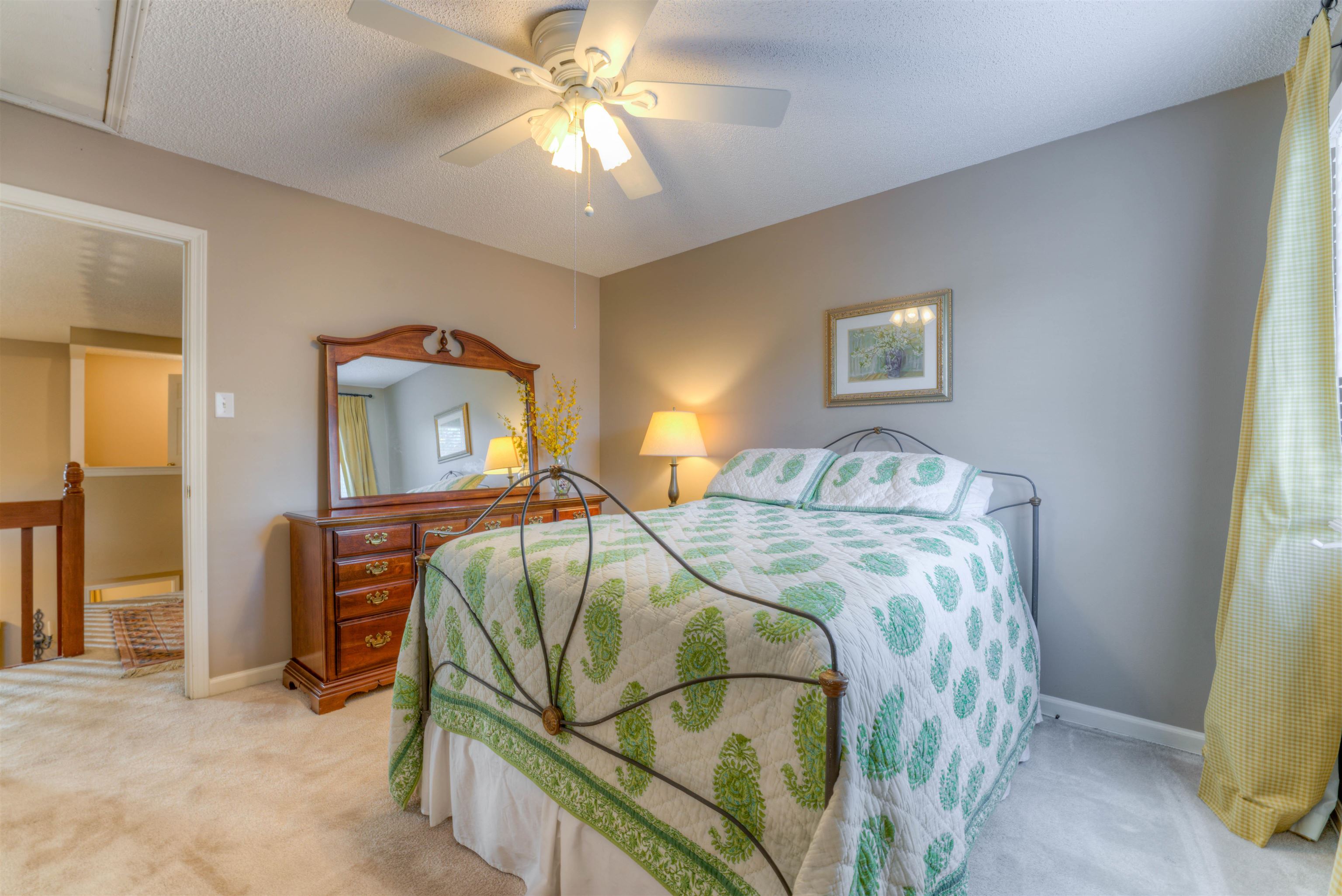 Bedroom with ceiling fan and carpet