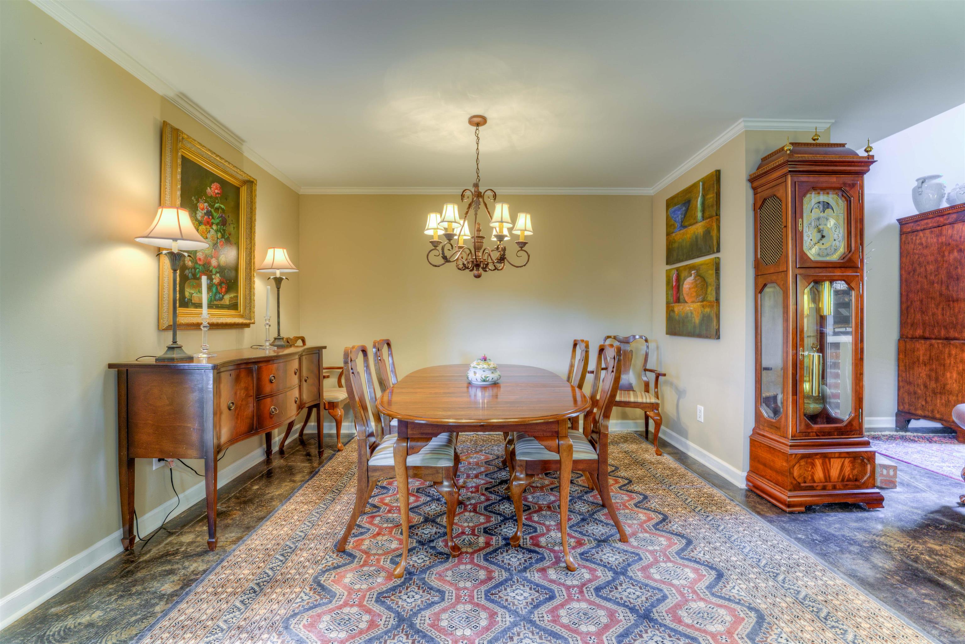 Dining room featuring an inviting chandelier and ornamental molding