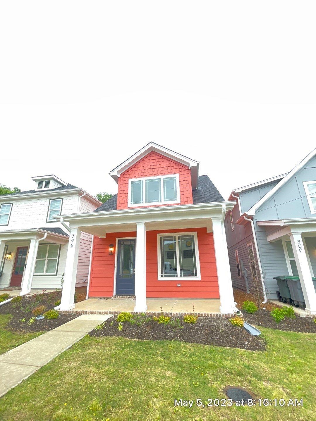 View of front of property featuring a front yard and a porch