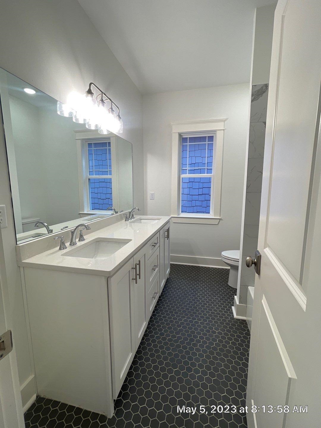 Bathroom featuring vanity and toilet