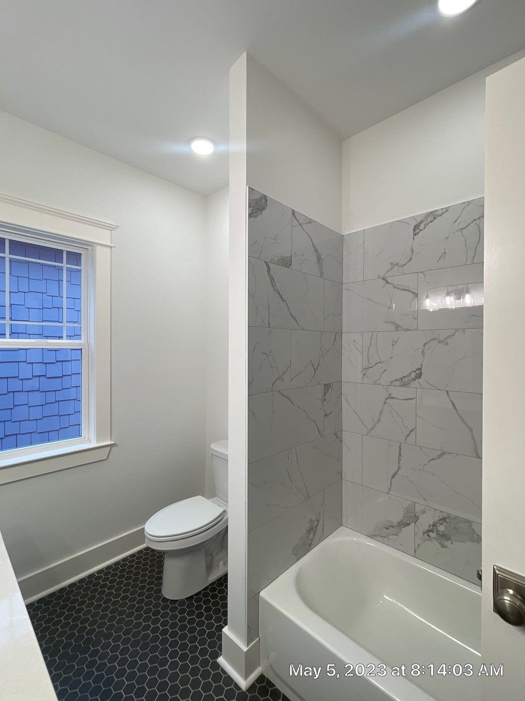 Bathroom with toilet and plus walk in shower