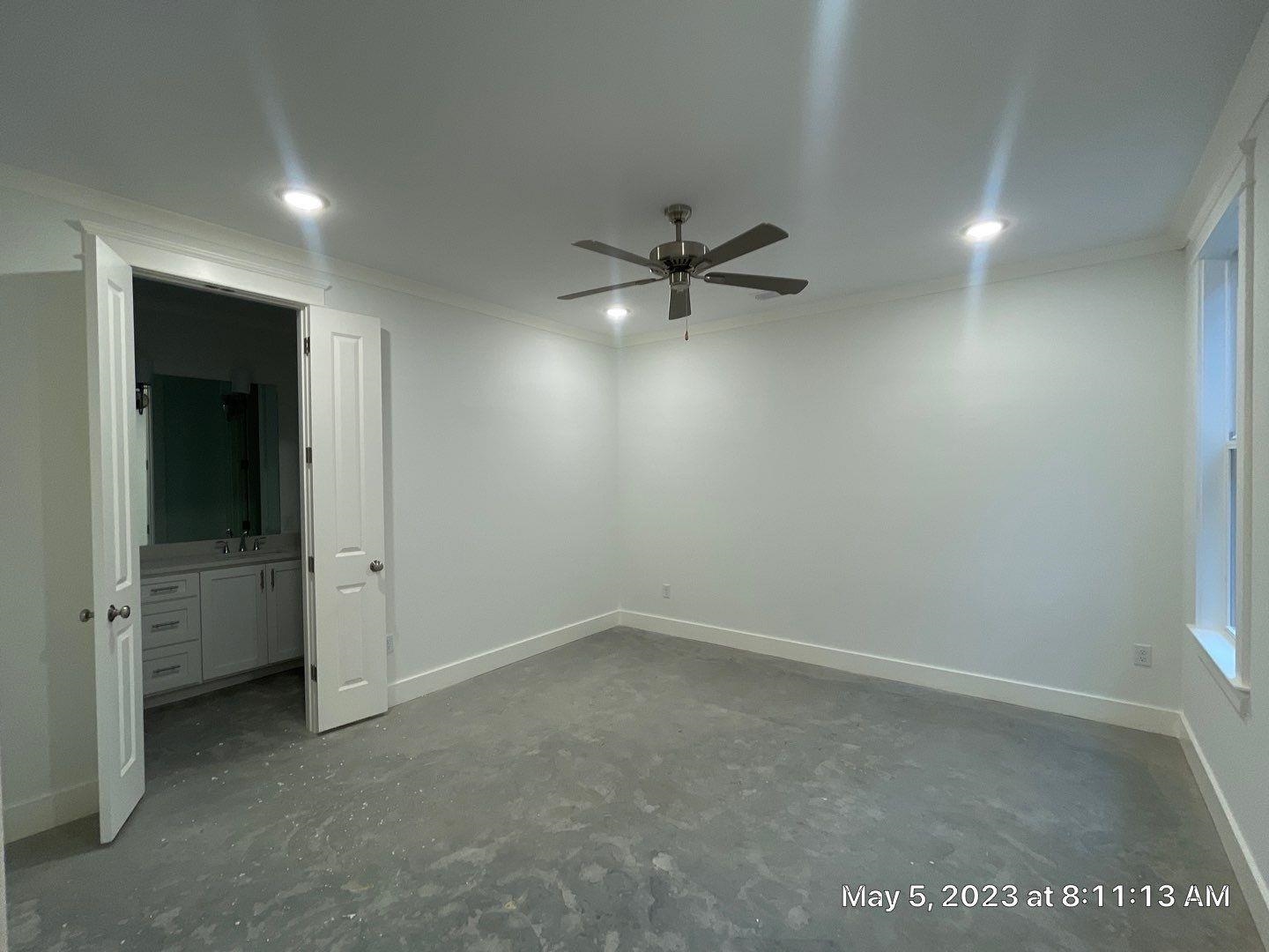 Spare room featuring crown molding, sink, and ceiling fan
