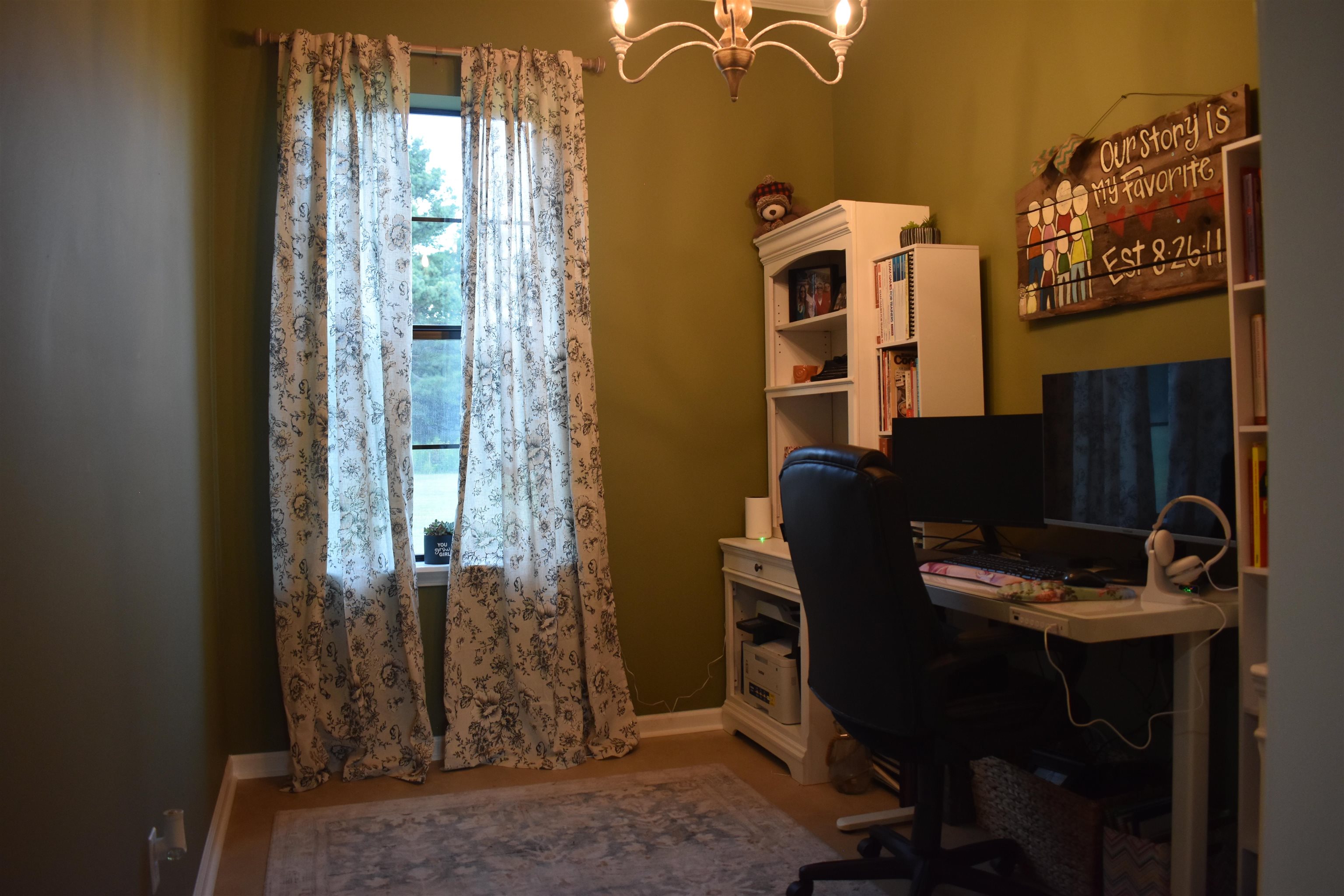 Home office with an inviting chandelier