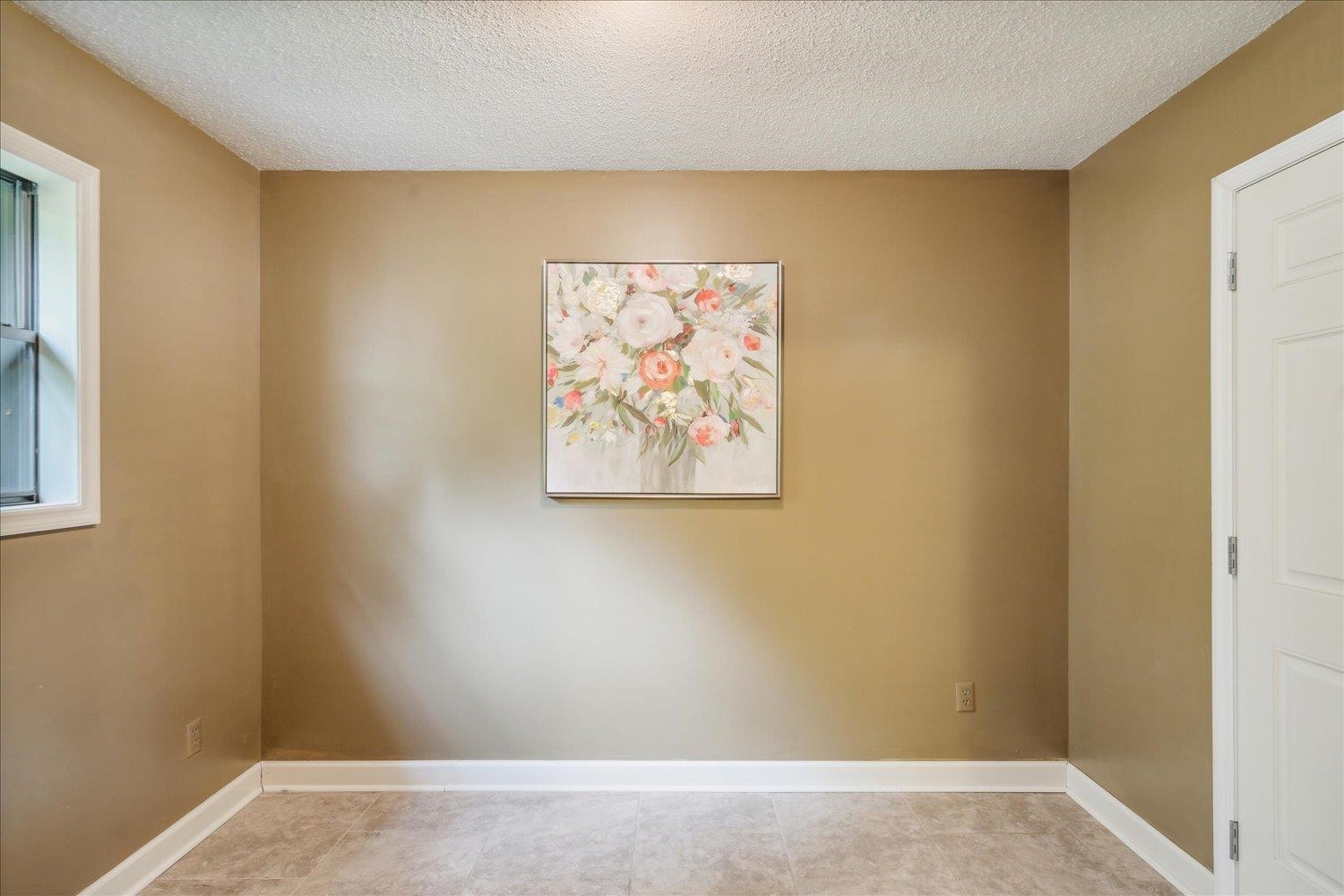 Spare room featuring a textured ceiling