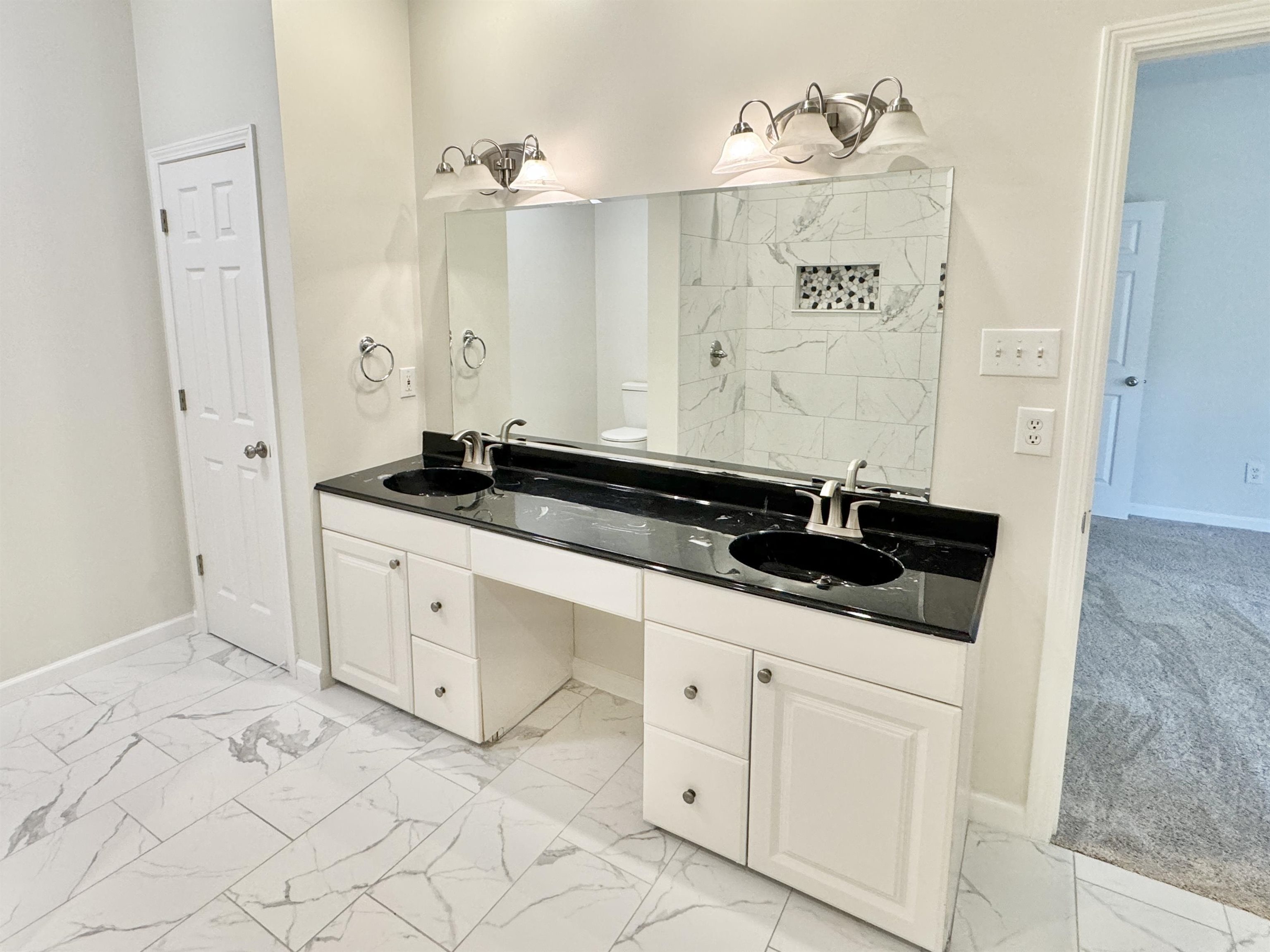 Bathroom with a shower, toilet, and vanity