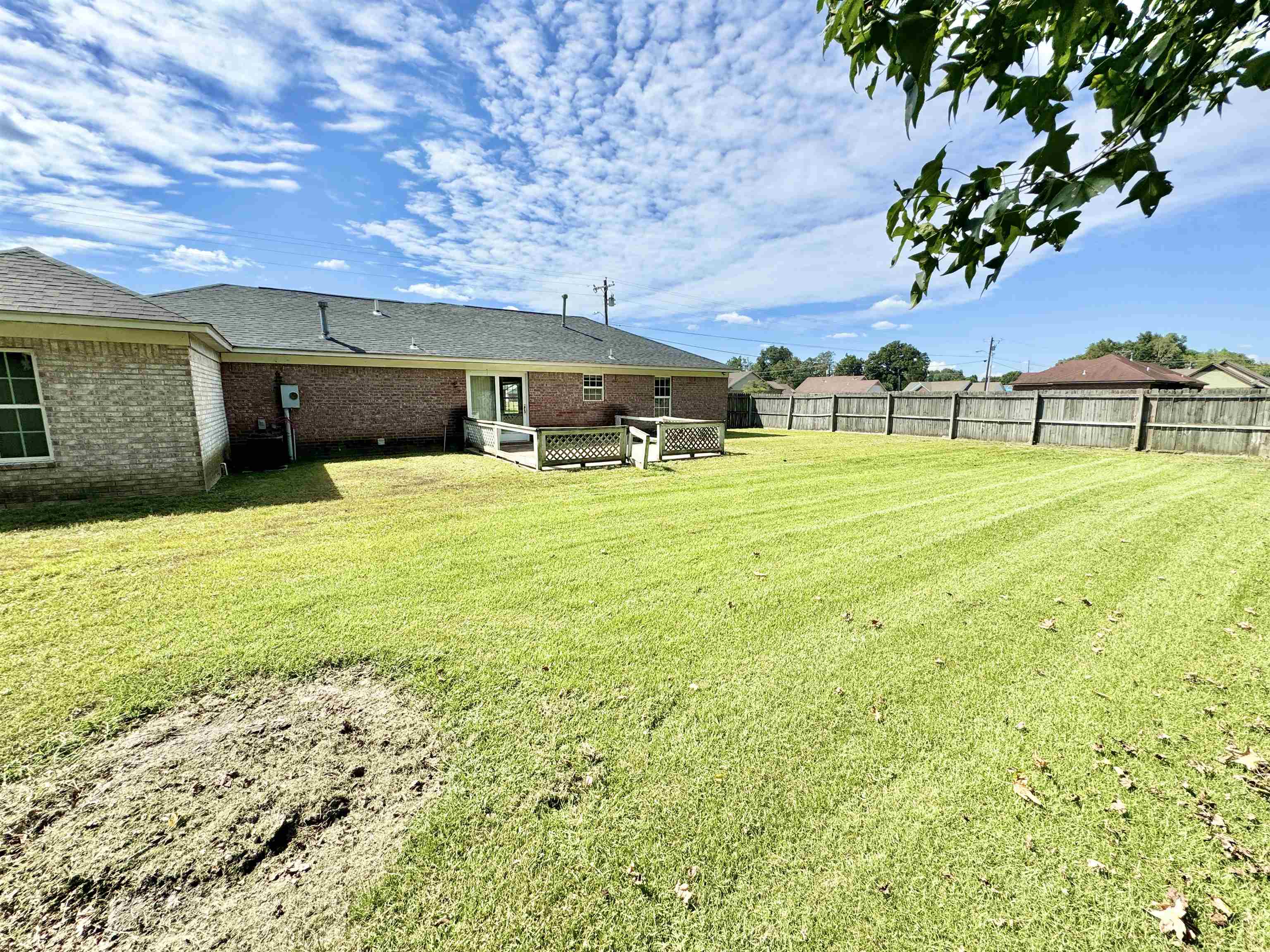 View of yard with a wooden deck