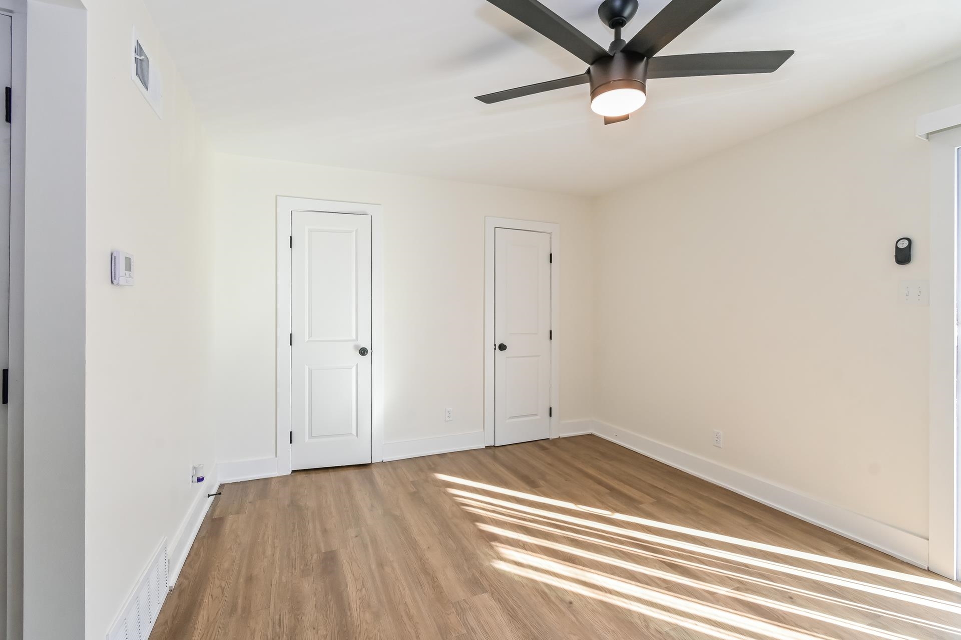 Unfurnished bedroom with light hardwood / wood-style flooring and ceiling fan