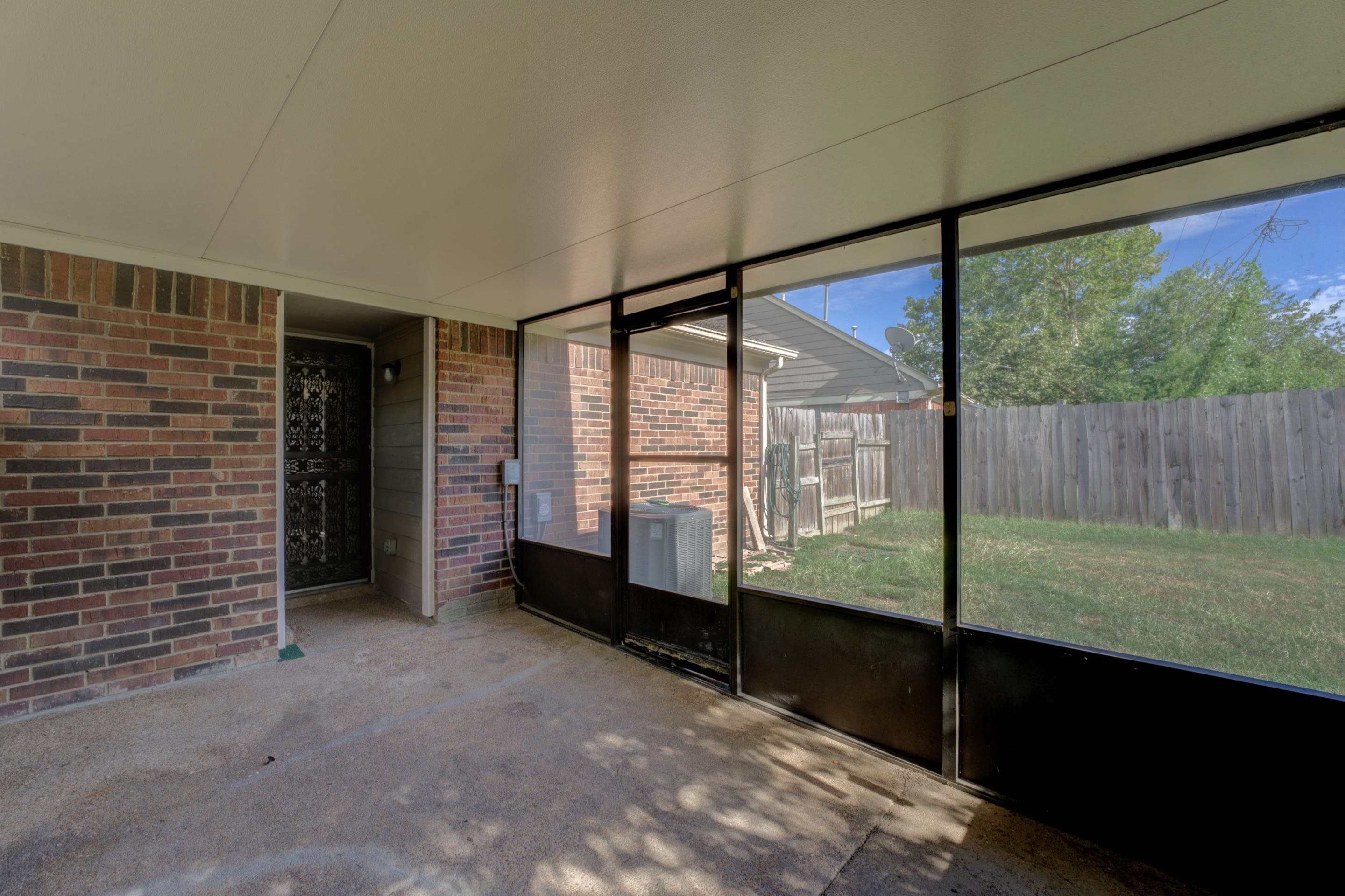 Unfurnished sunroom featuring a wealth of natural light