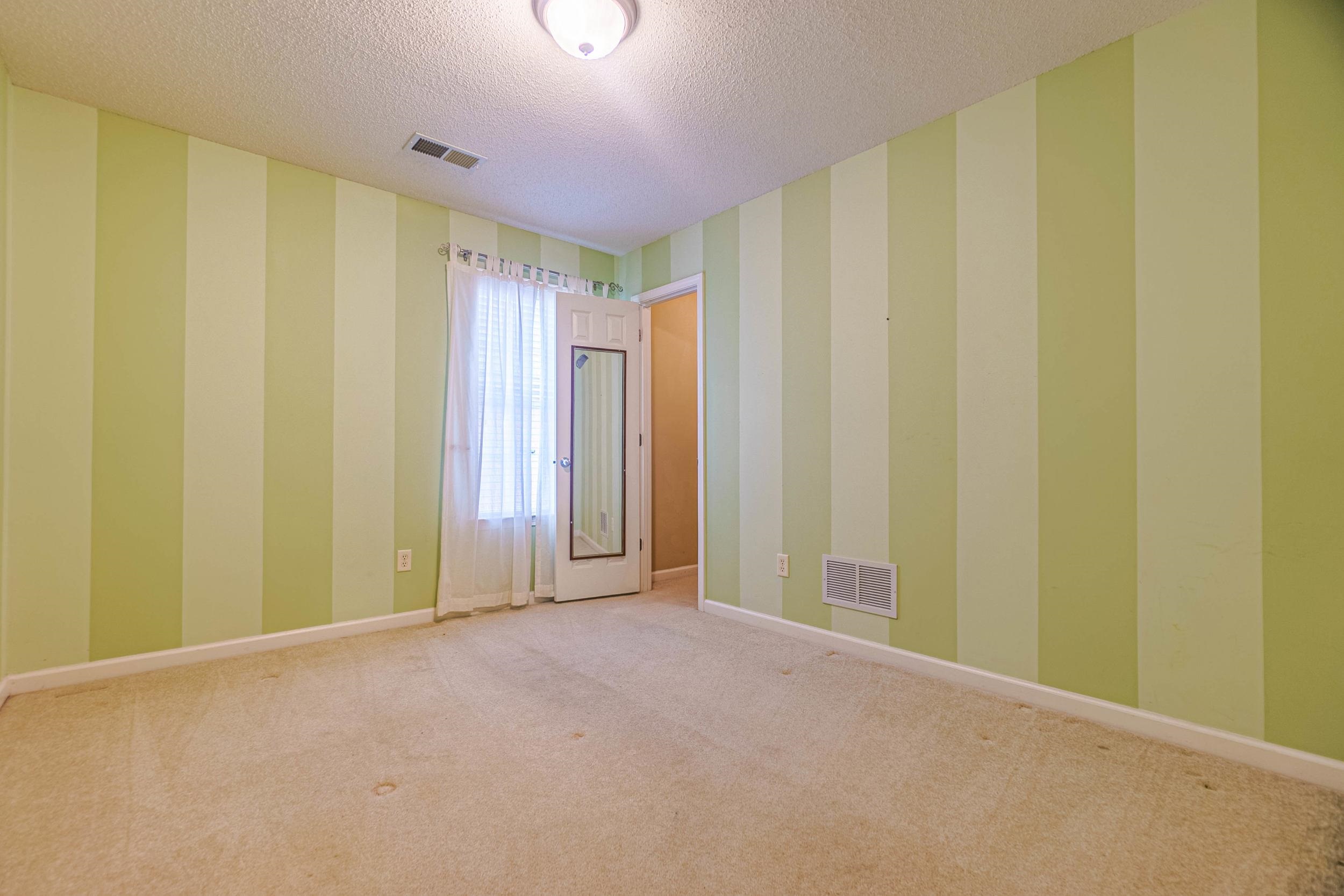 Carpeted spare room with a textured ceiling