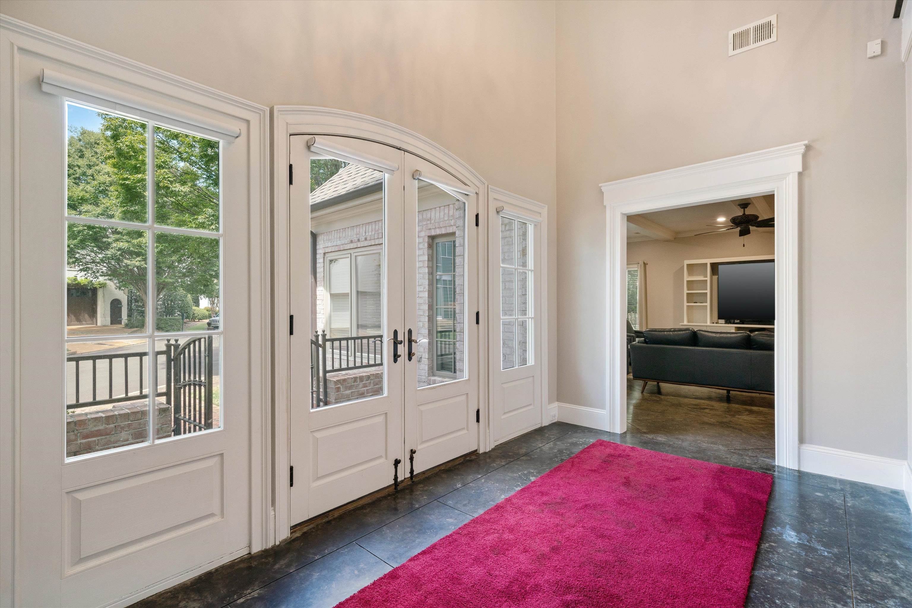 Entryway with ceiling fan and french doors