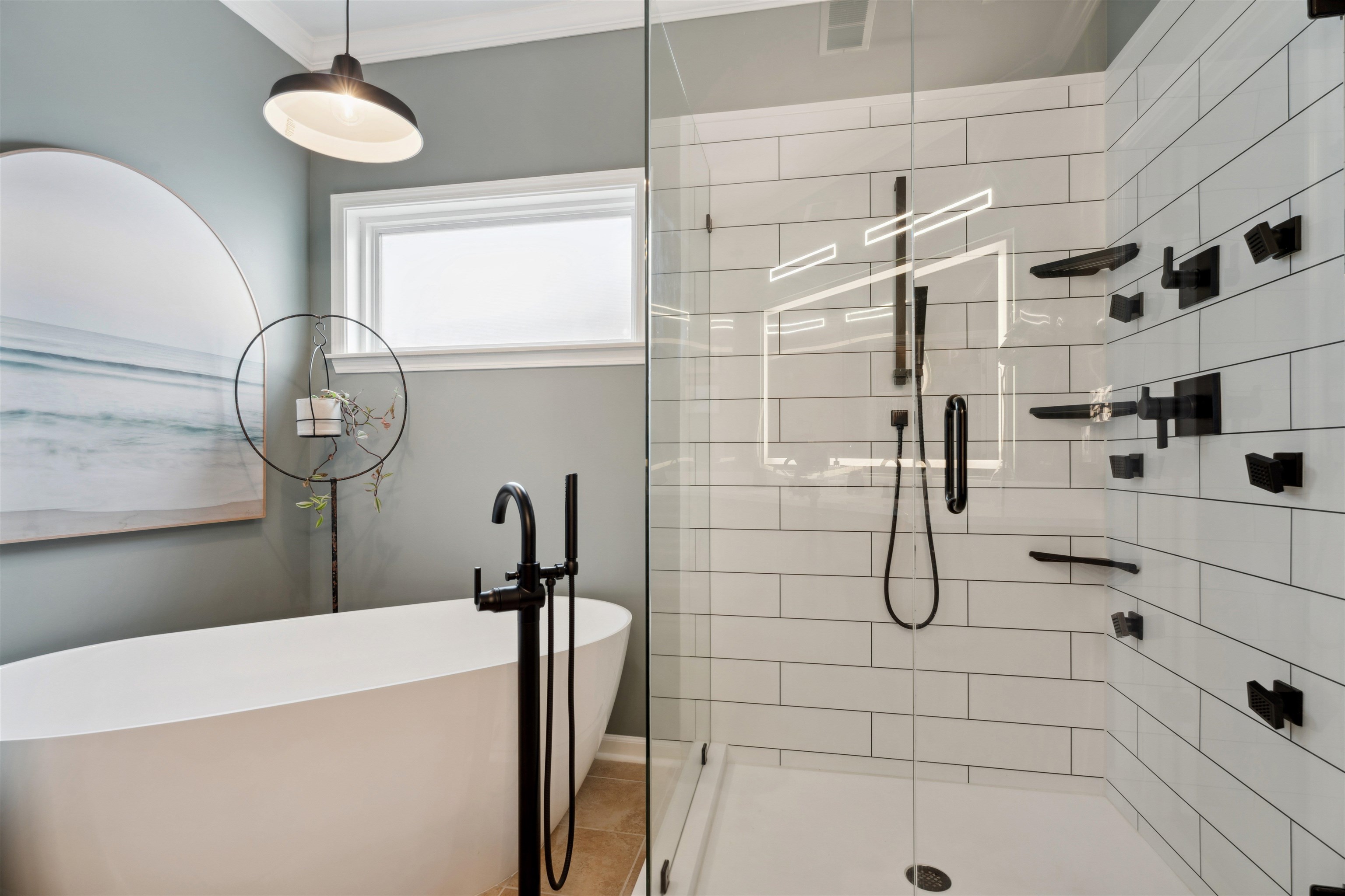 Bathroom featuring porcelain soaking tub plus walk in shower