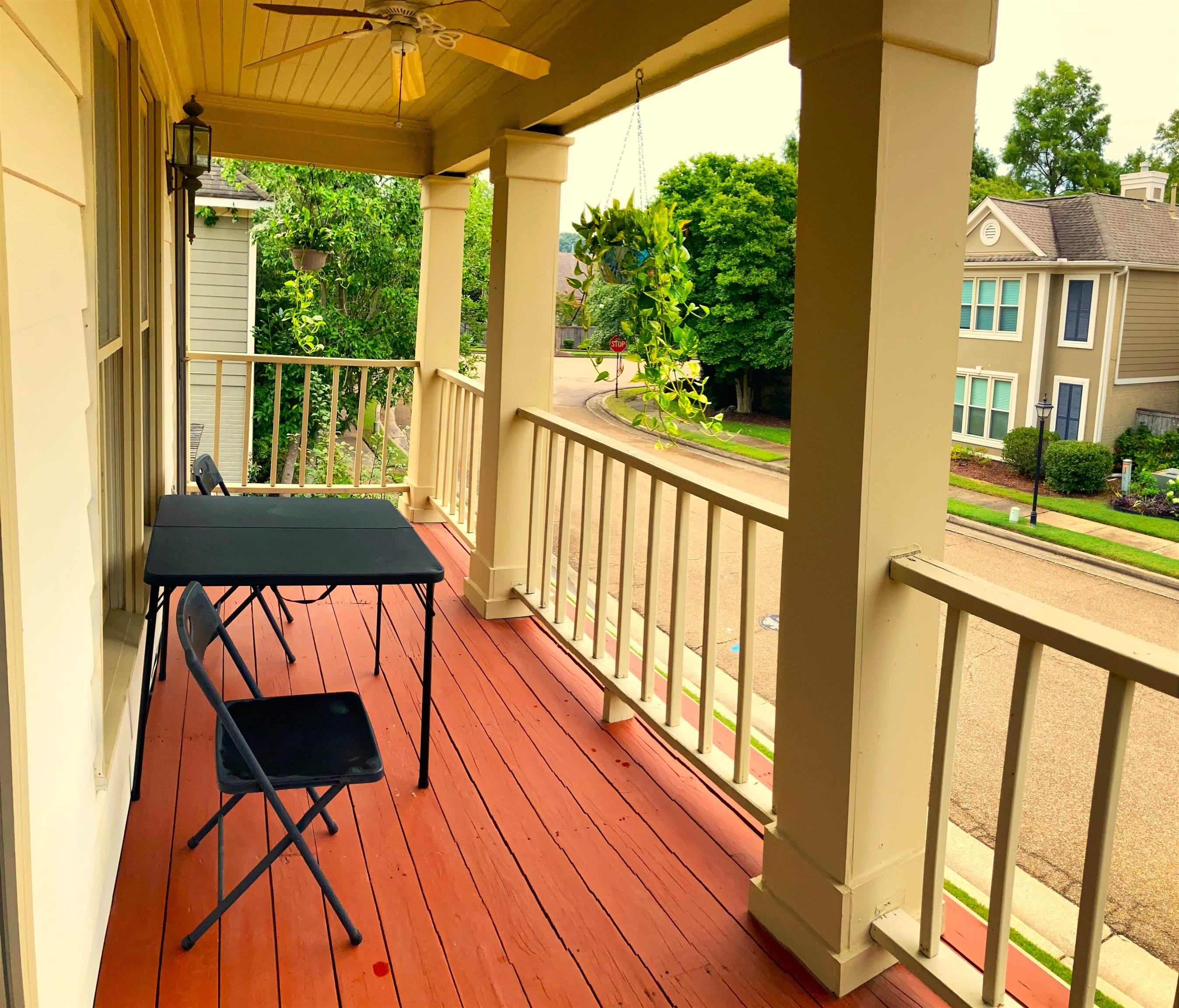 Deck with a porch and ceiling fan