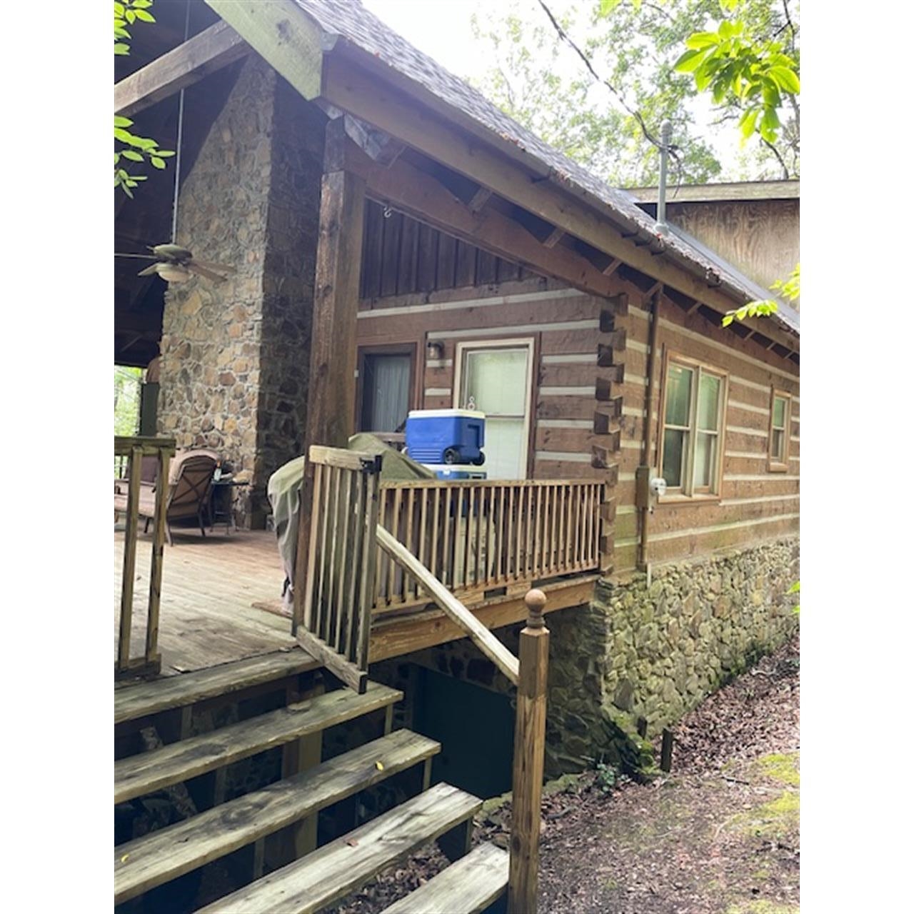 Exterior space featuring ceiling fan and a wooden deck