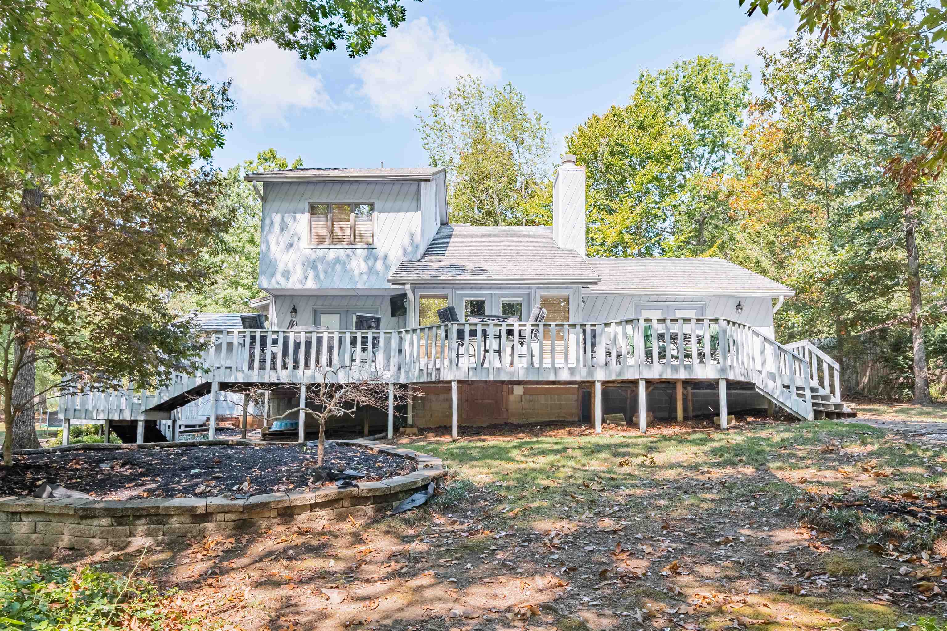 Rear view of property with a wooden deck