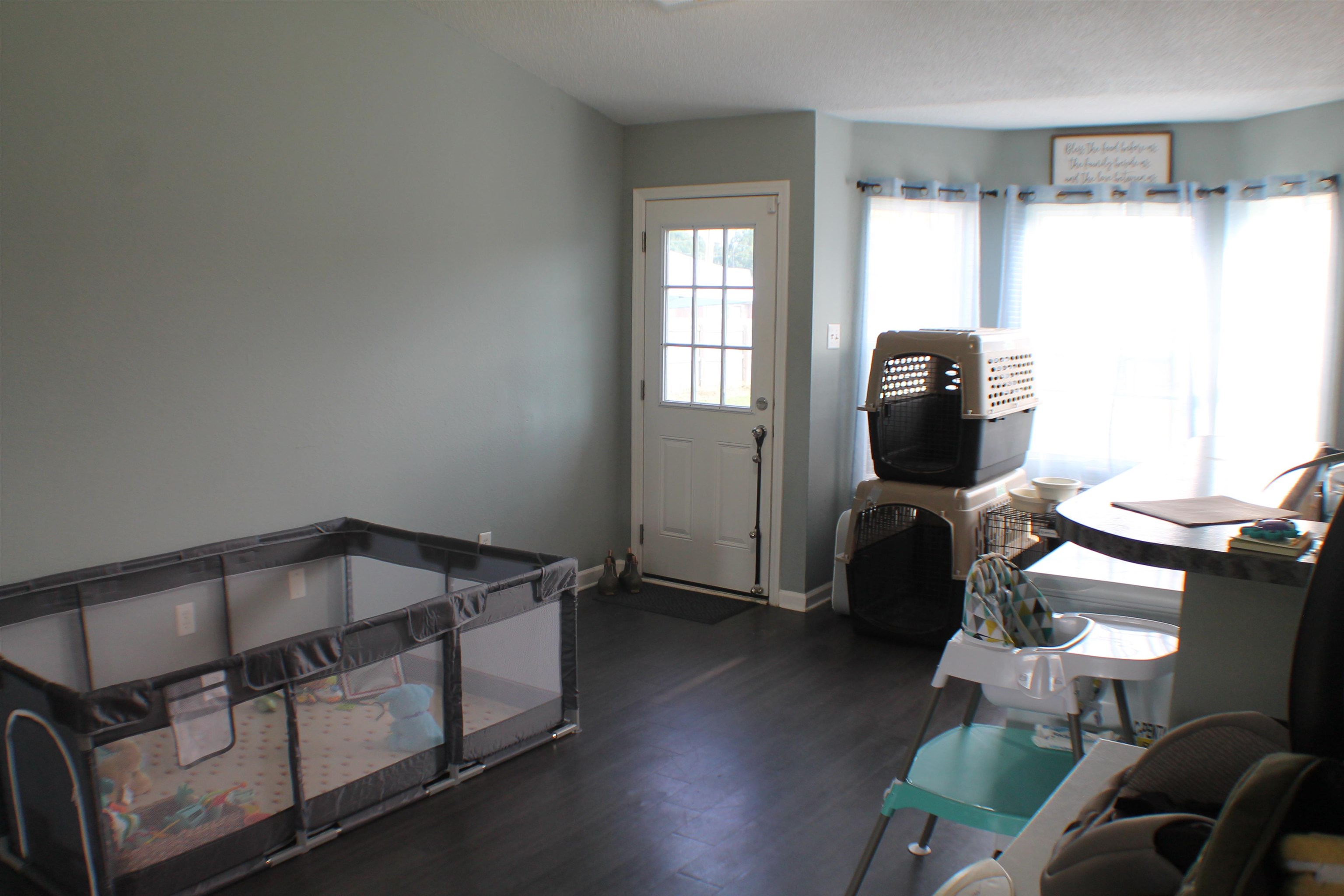 Entrance foyer with dark hardwood / wood-style floors