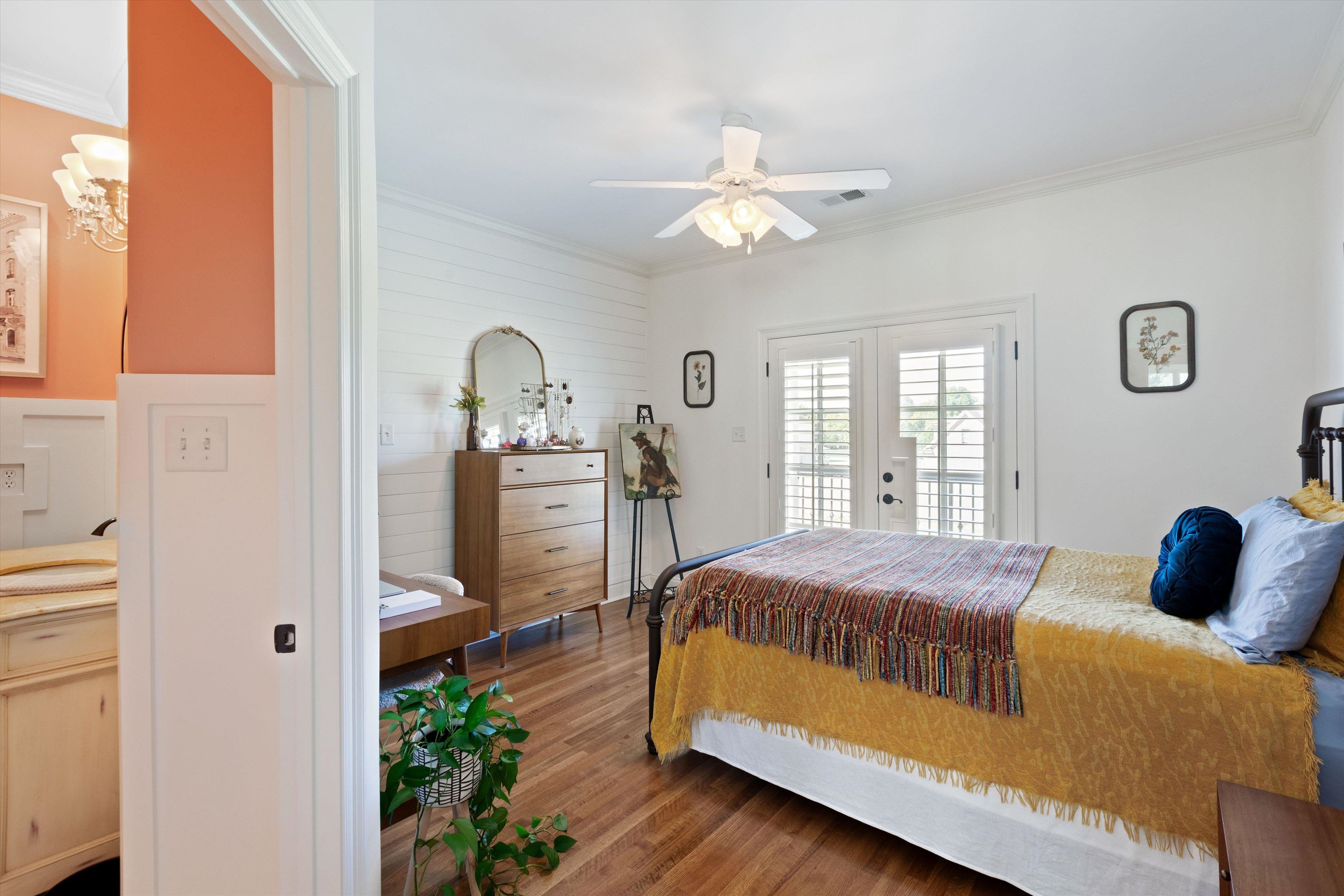 Another en-suite bedroom, pretty shiplap walls, also w separate entrance to front porch/balcony. Has large walk-in closet.