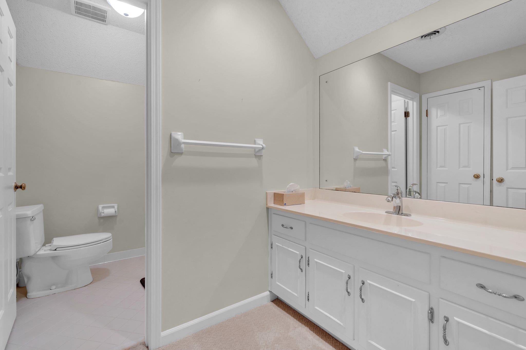 Bathroom with vanity and toilet