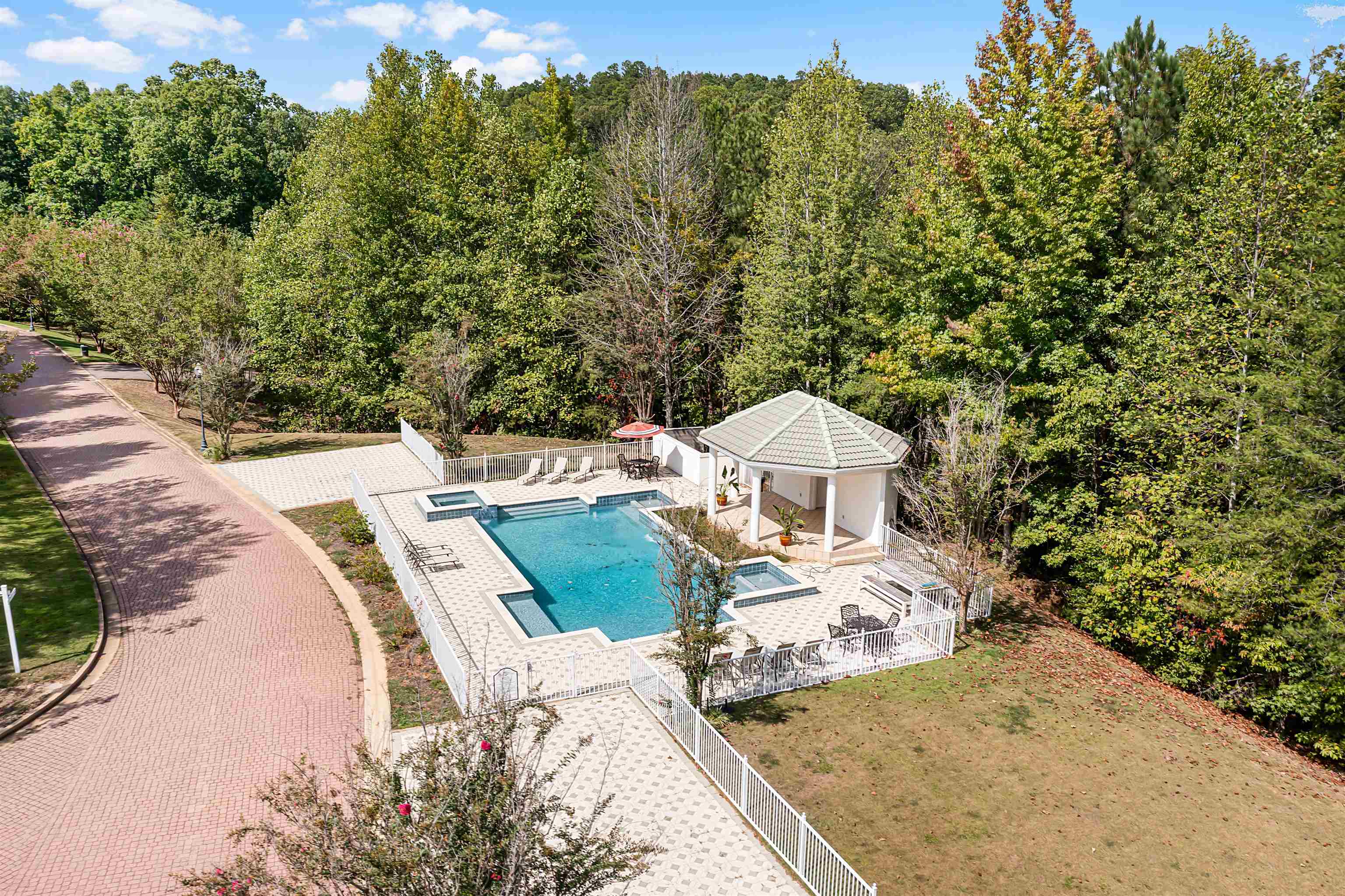 View of swimming pool with a patio and a gazebo