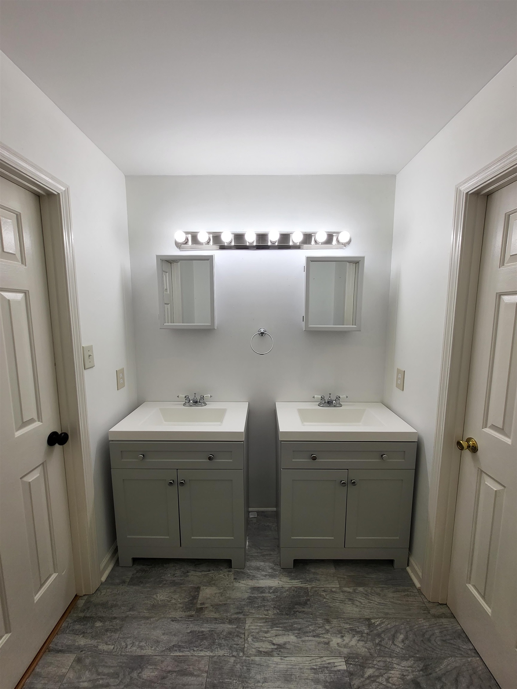 Bathroom with vanity and wood-type flooring