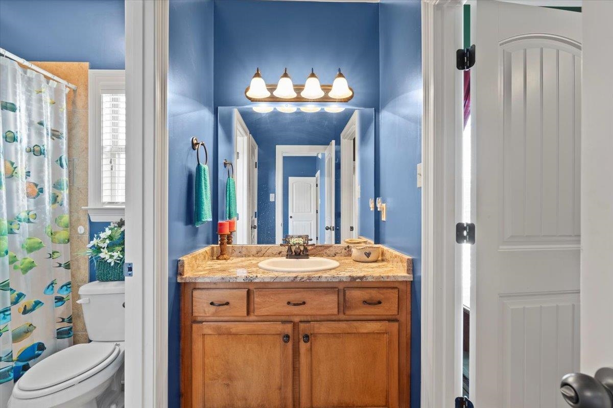 Bathroom with vanity and toilet