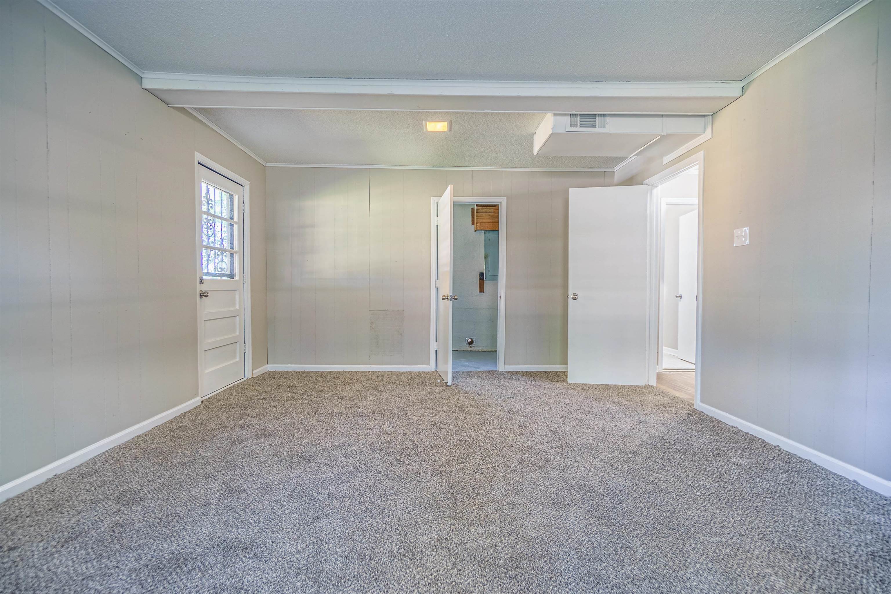 Spare room with carpet floors and ornamental molding