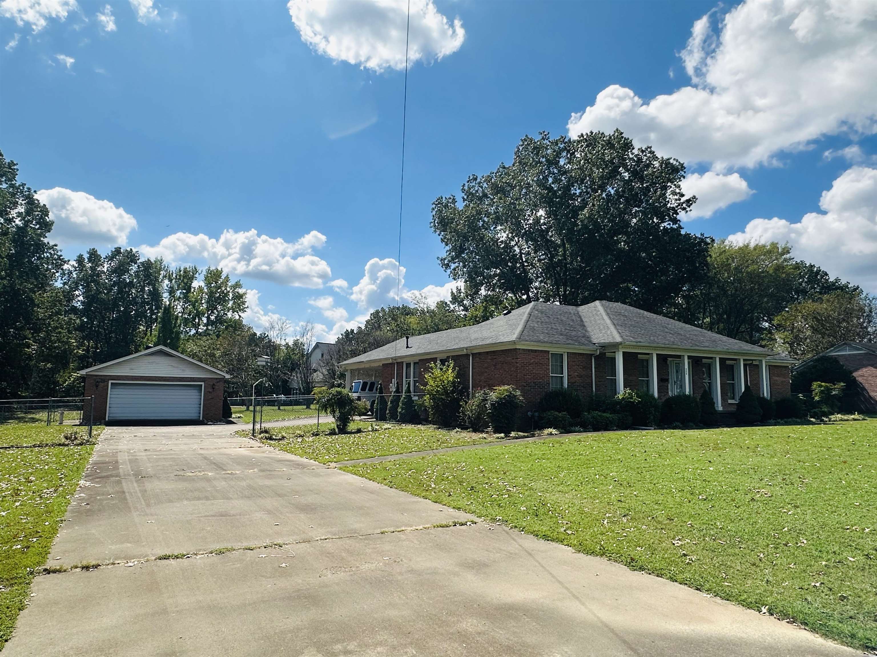 Ranch-style home with a front lawn