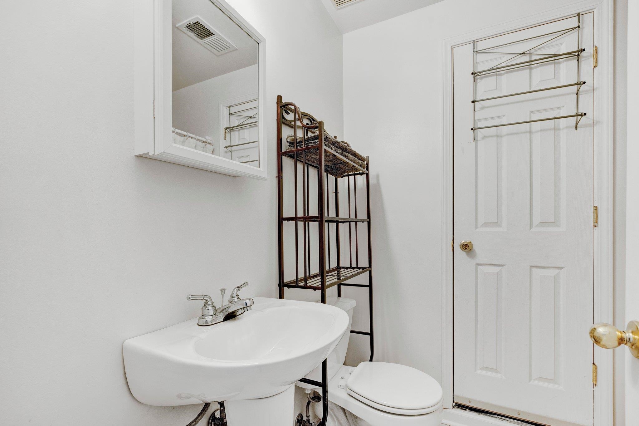 Bathroom featuring sink and toilet