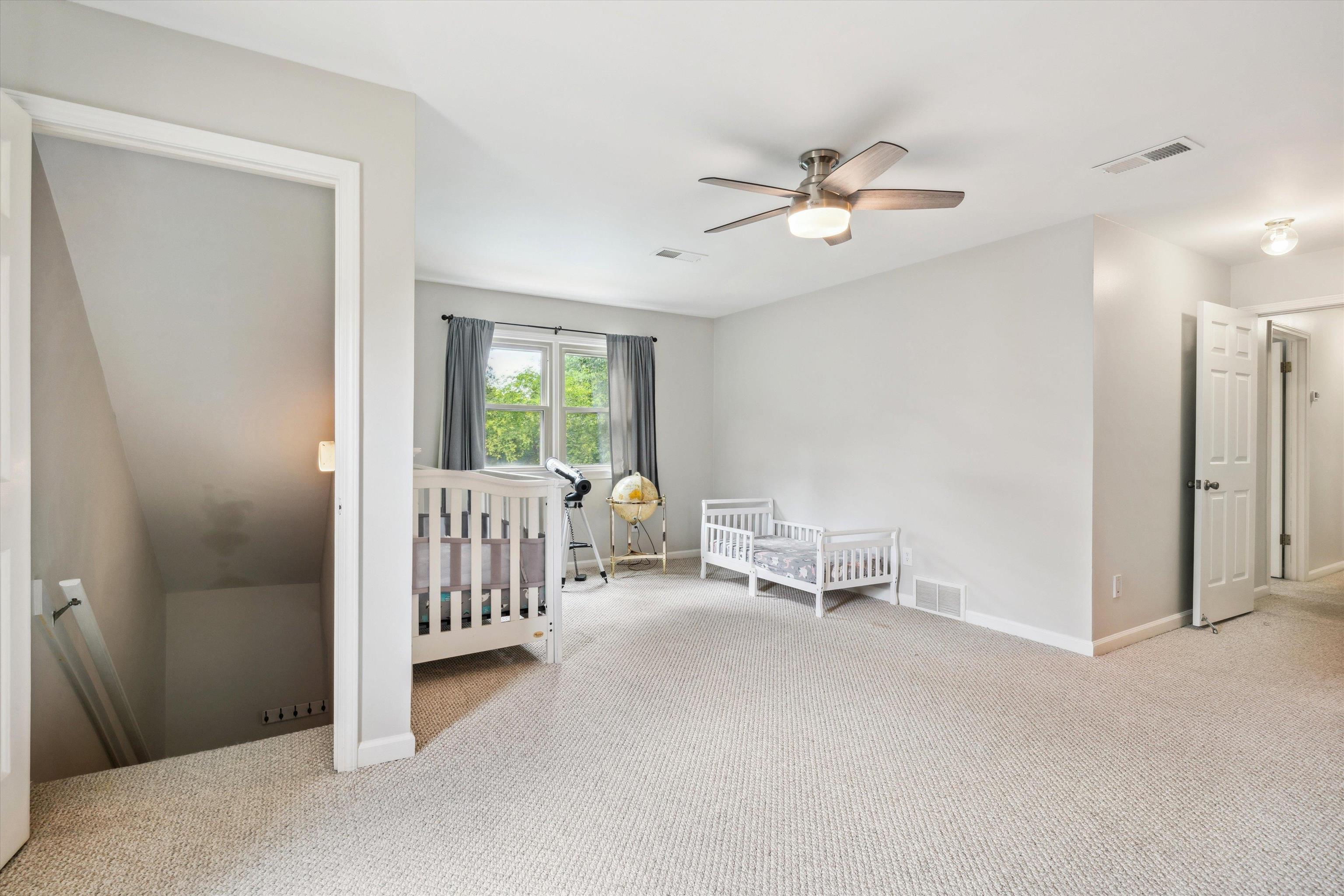 Rear staircase with a door adjacent to this wonderfully versatile space!