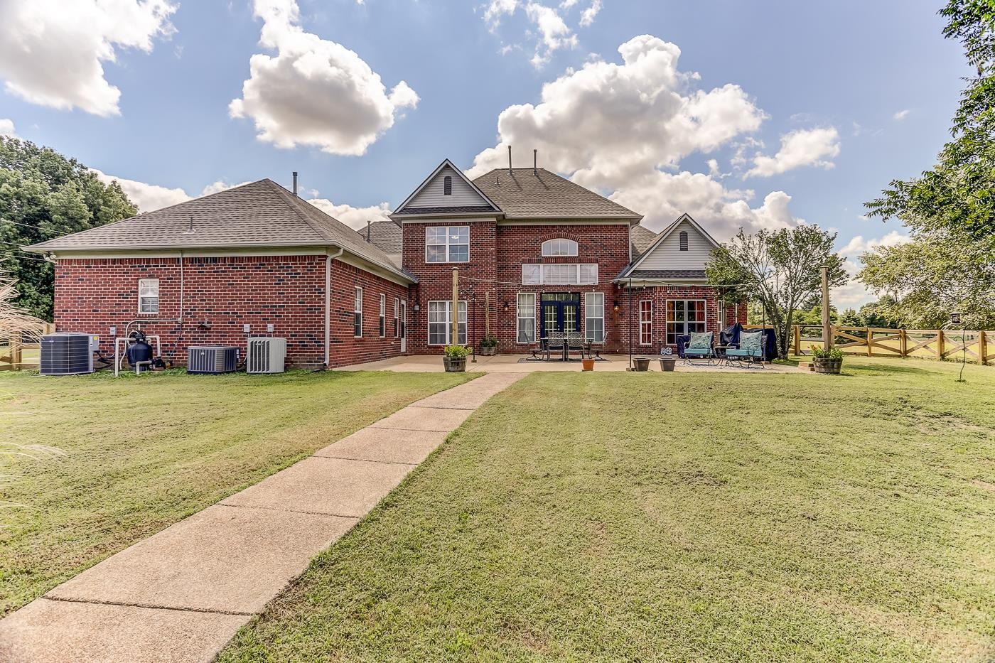 Back of property featuring a patio area.