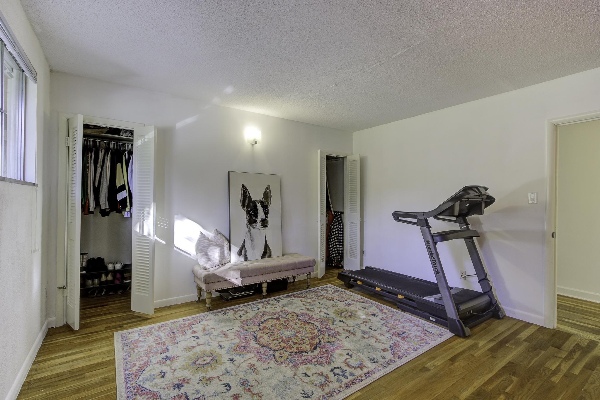 The fourth bedroom is used as an exercise room (and adjoins the primary bath).