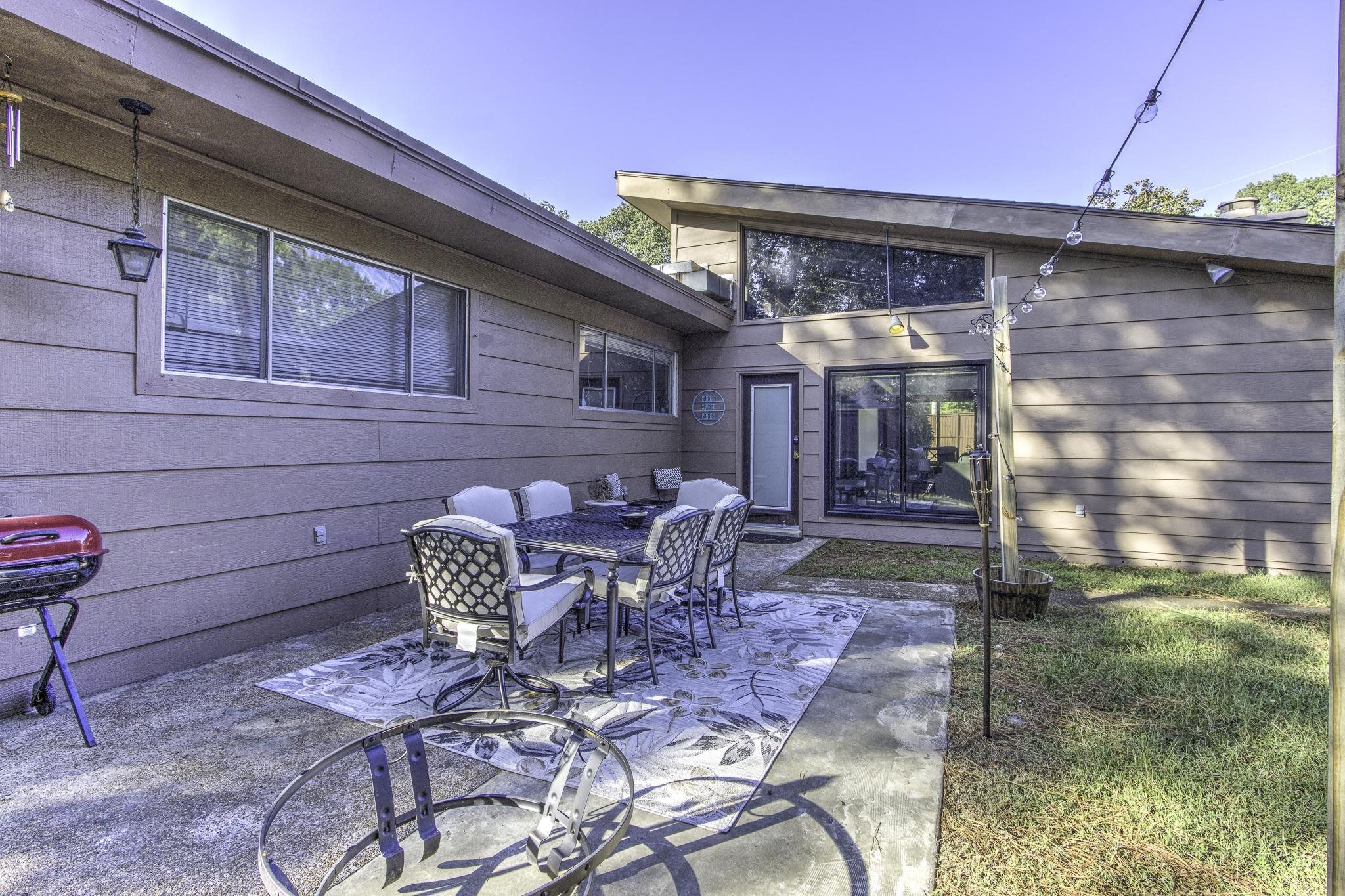 This patio is located on the south side of the yard, and leads into the 2nd entrance to the den.