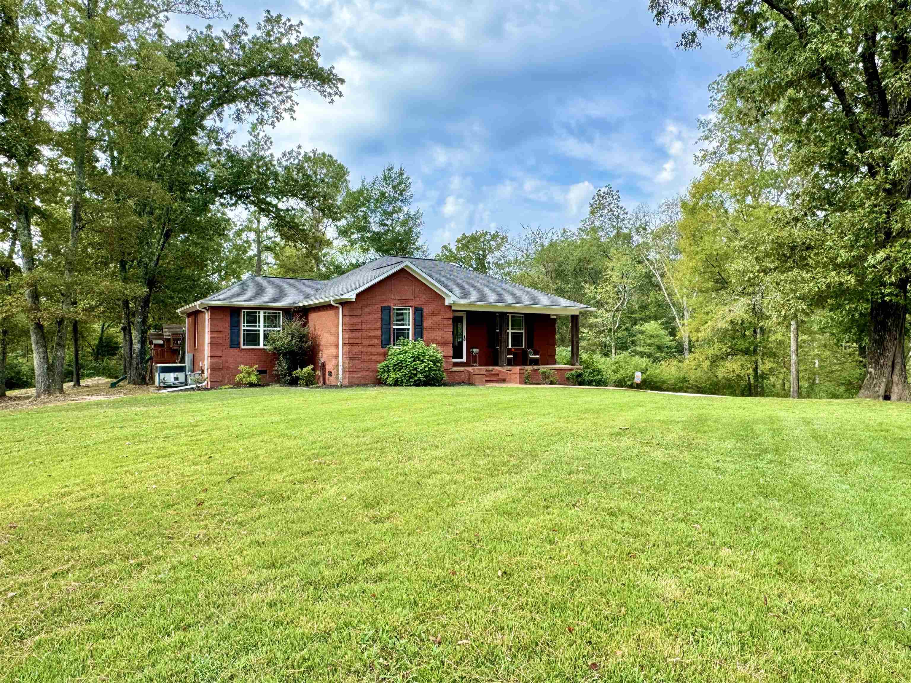 Single story home with a front lawn