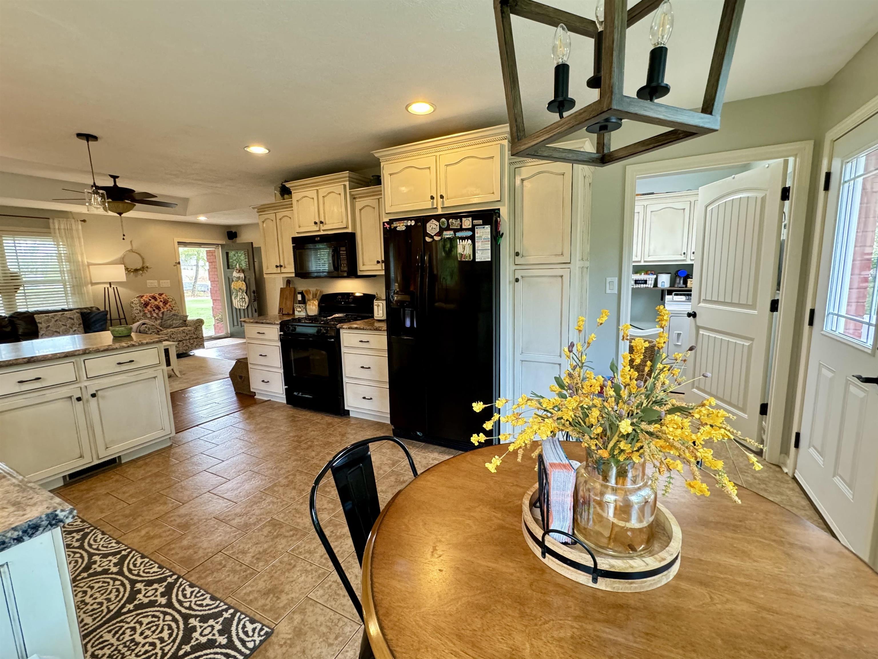 Dining room with ceiling fan and plenty of natural light