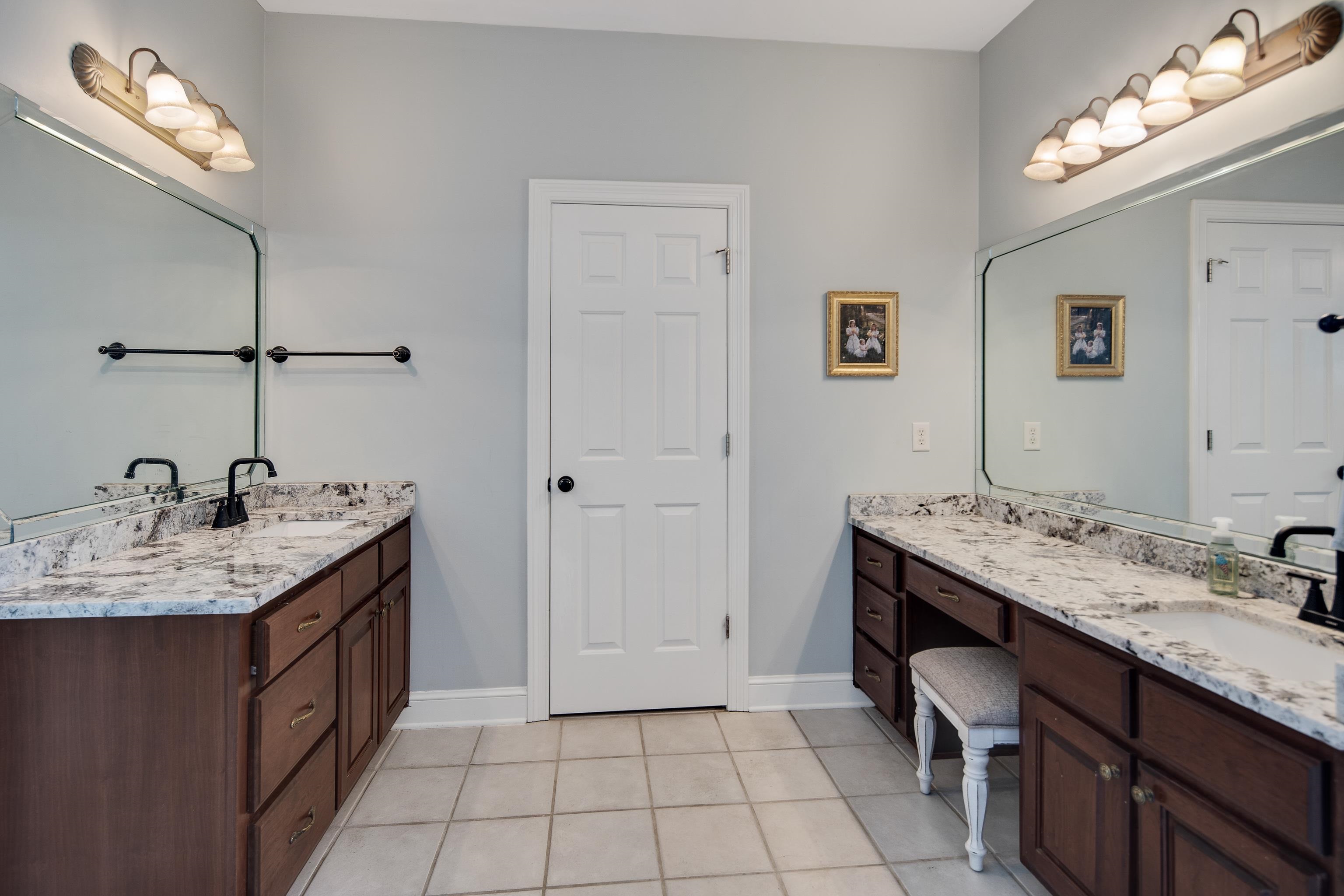 Bathroom with vanity and tile patterned floors