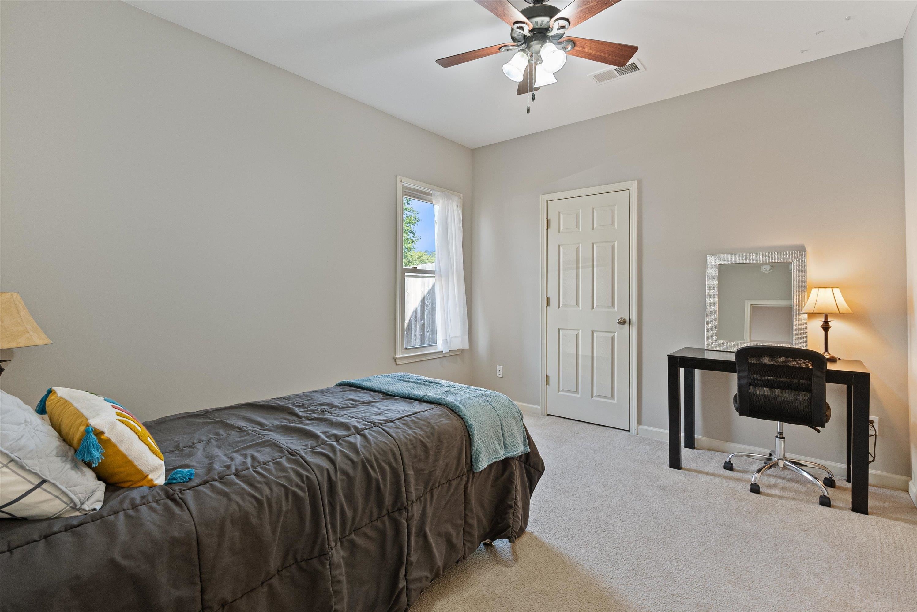 on the first floor with ceiling fan, could be a home office